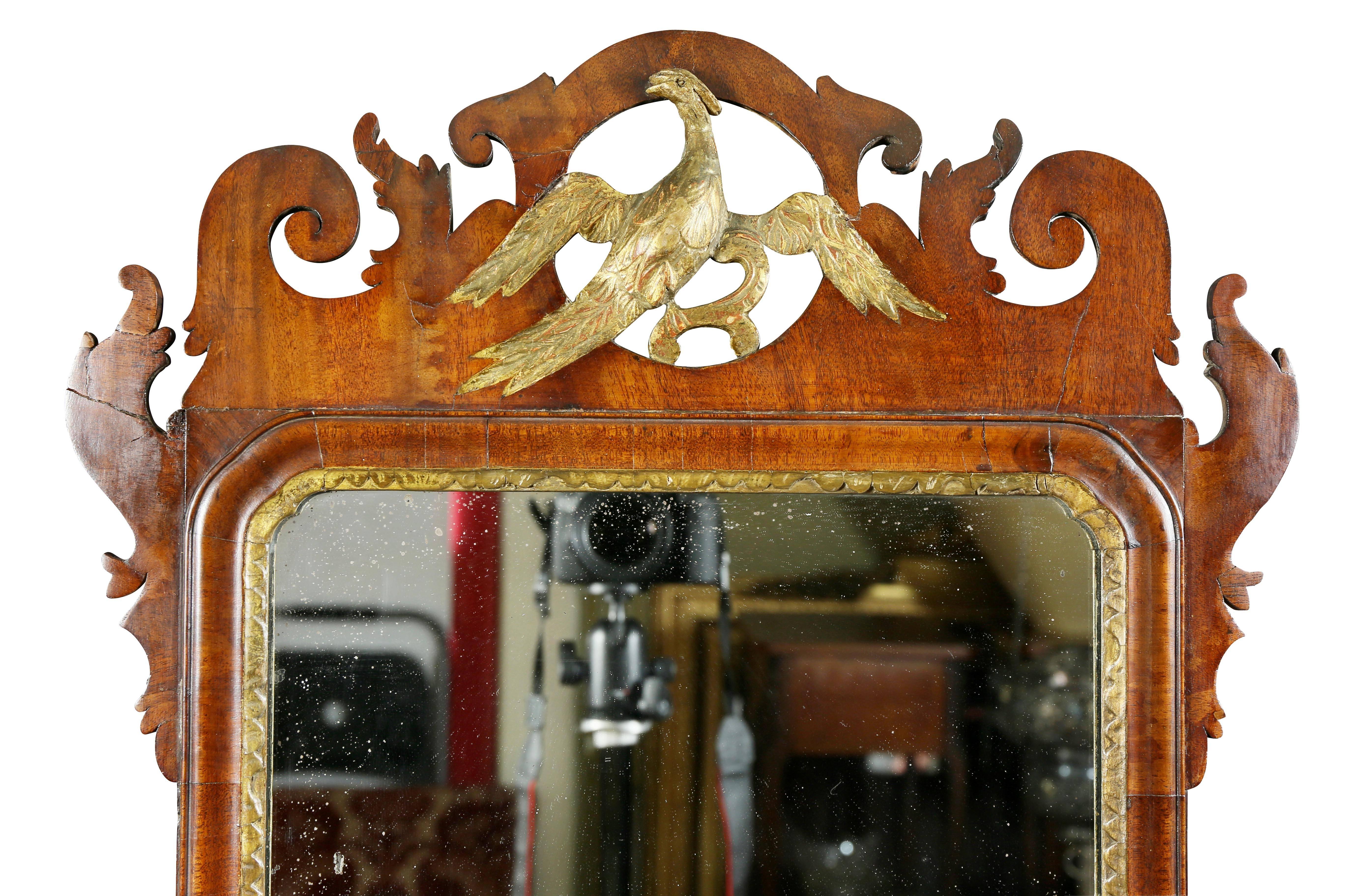 Scroll cut frame with central Ho Ho bird. Old mirror plate.