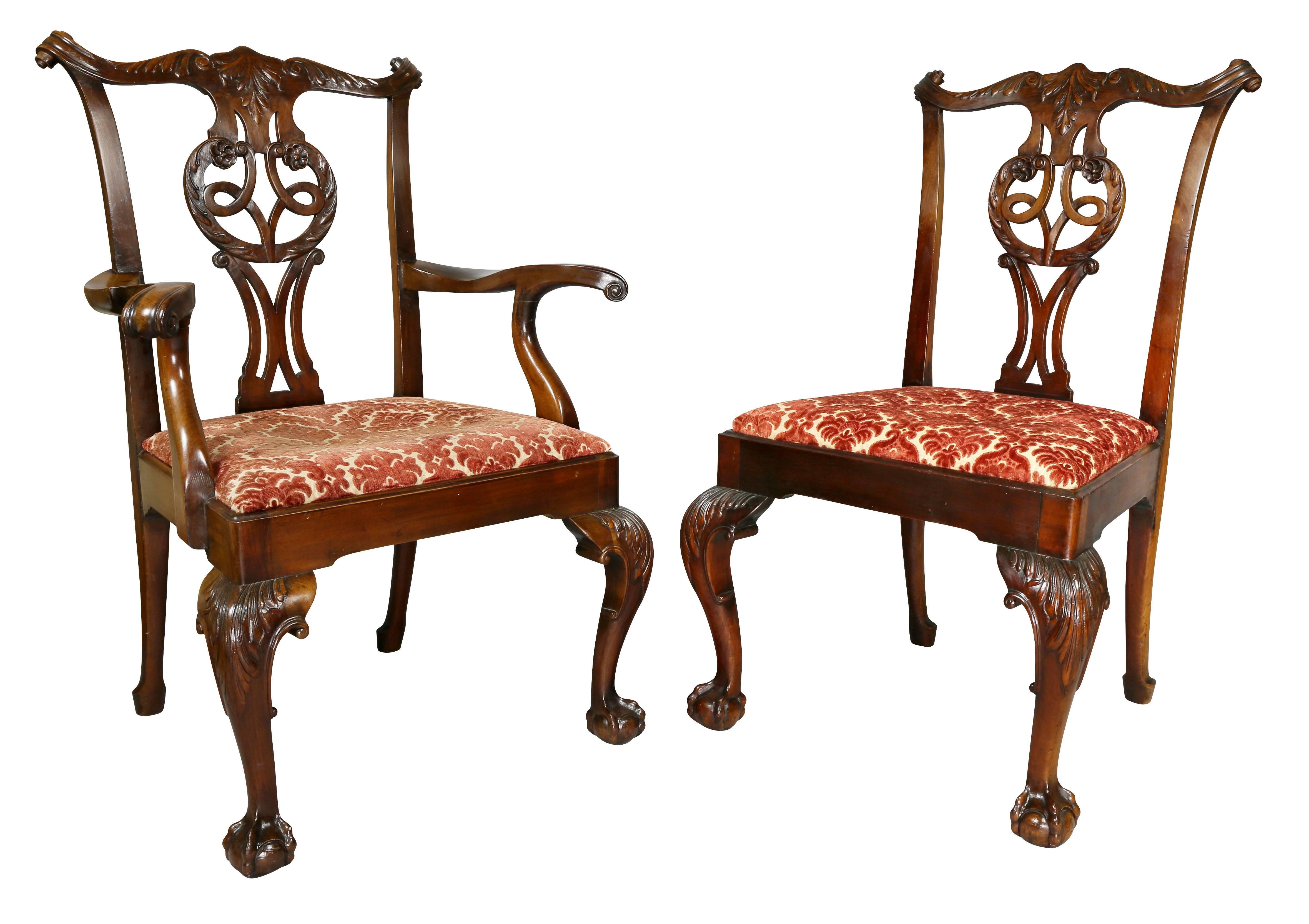 Each very sturdy and wonderful generous scale with serpentine carved crestrail over a pierced splat with carving and drop in upholstered seat raised on cabriole legs with ball and claw feet.
