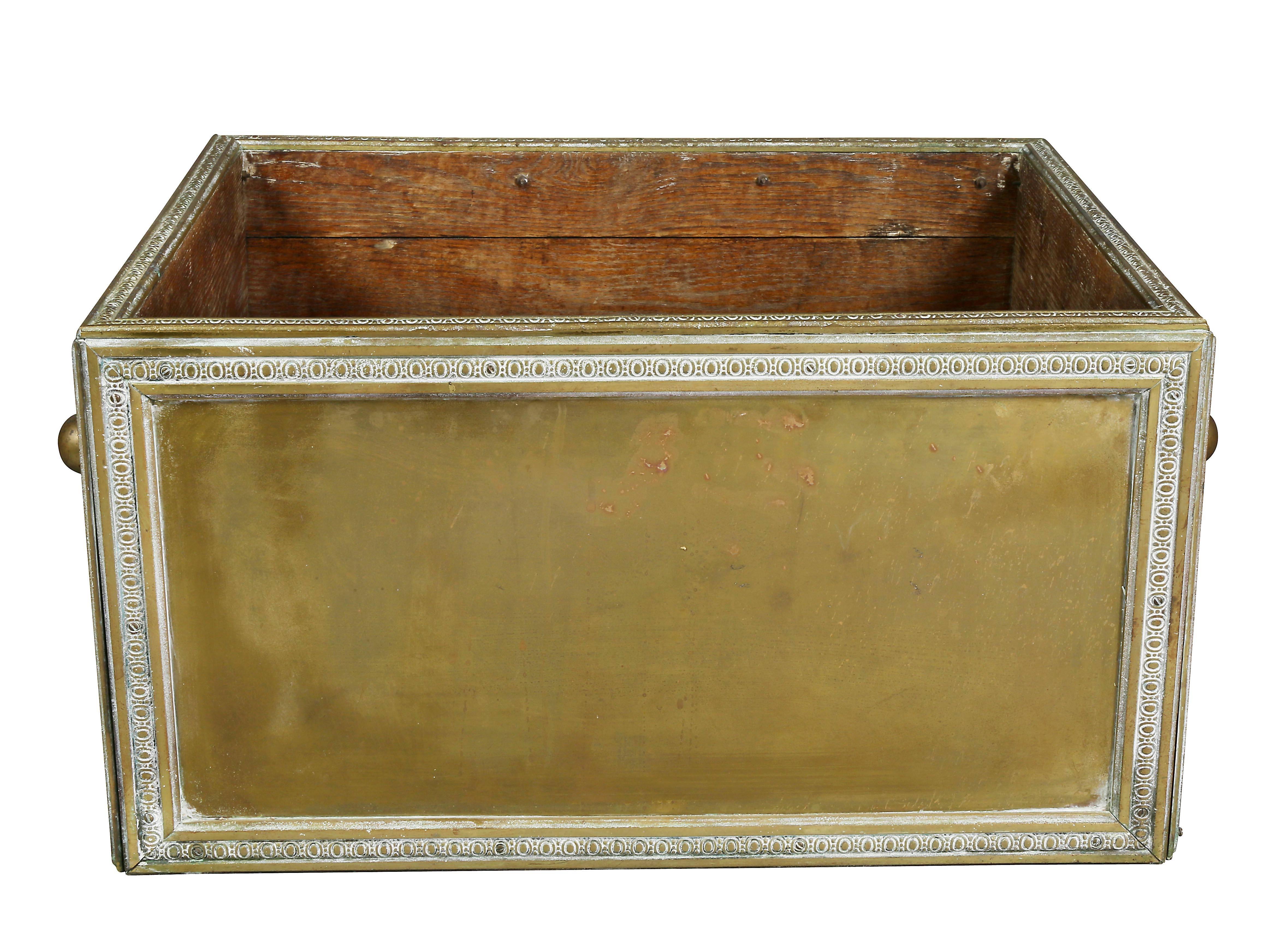 Rectangular with handles at each end. Cast decorative edging to the corners.