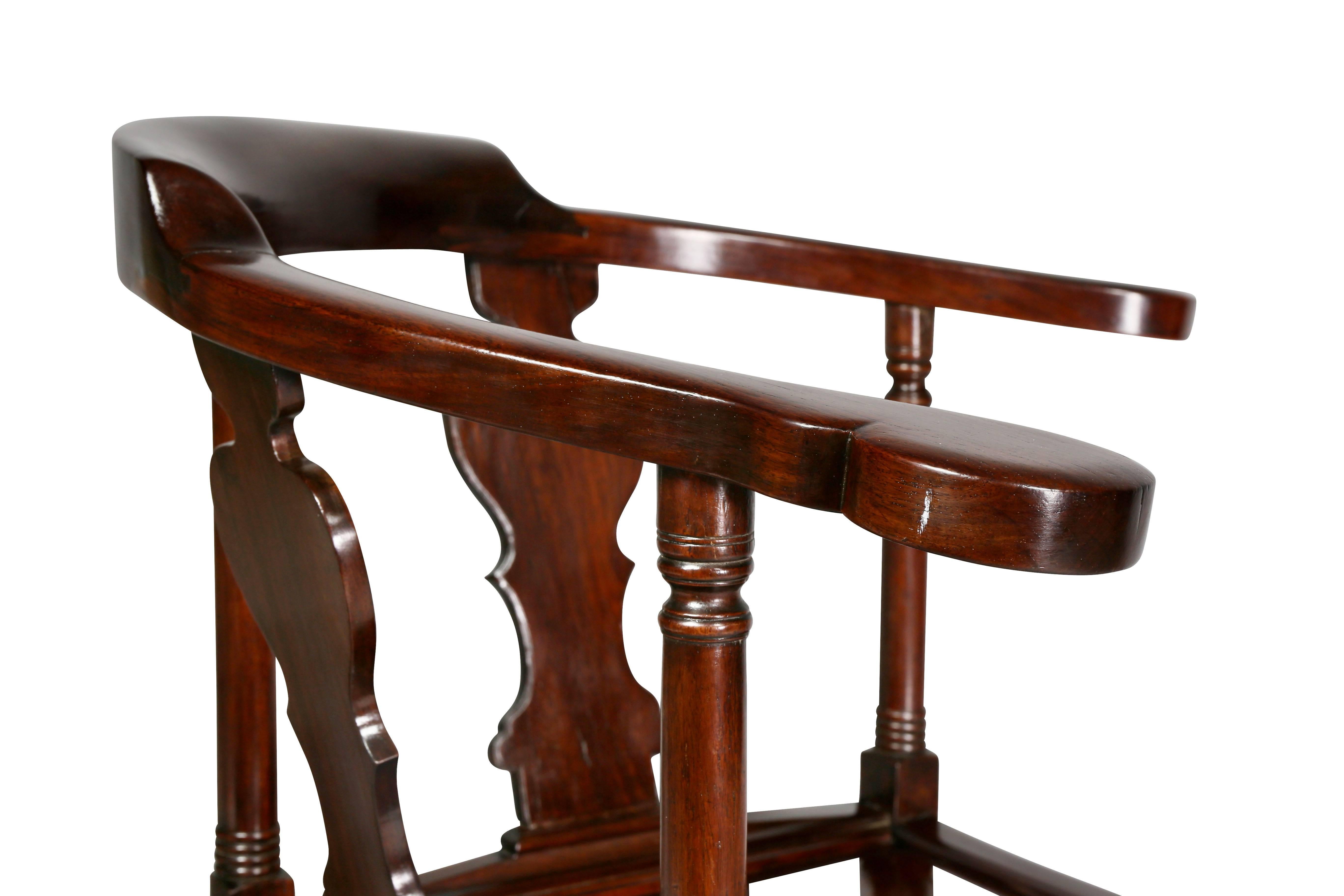 In the Georgian taste, horseshoe back, two vasiform splats, solid panel seat raised on a carved cabriole leg with claw and ball foot joined by a X-form turned stretcher.