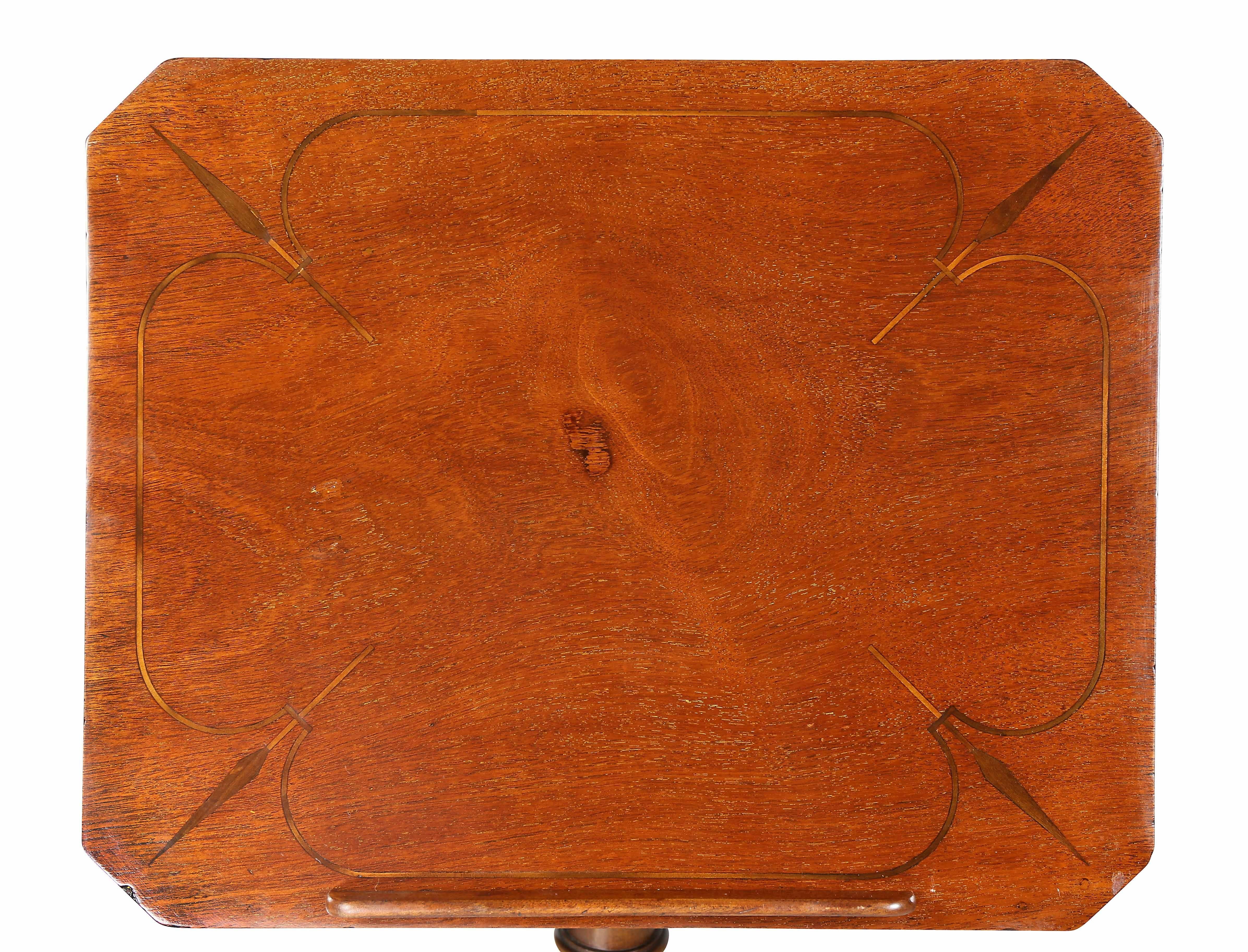 Rectangular adjustable top over a turned support with drawer,. raised on tripartite base.