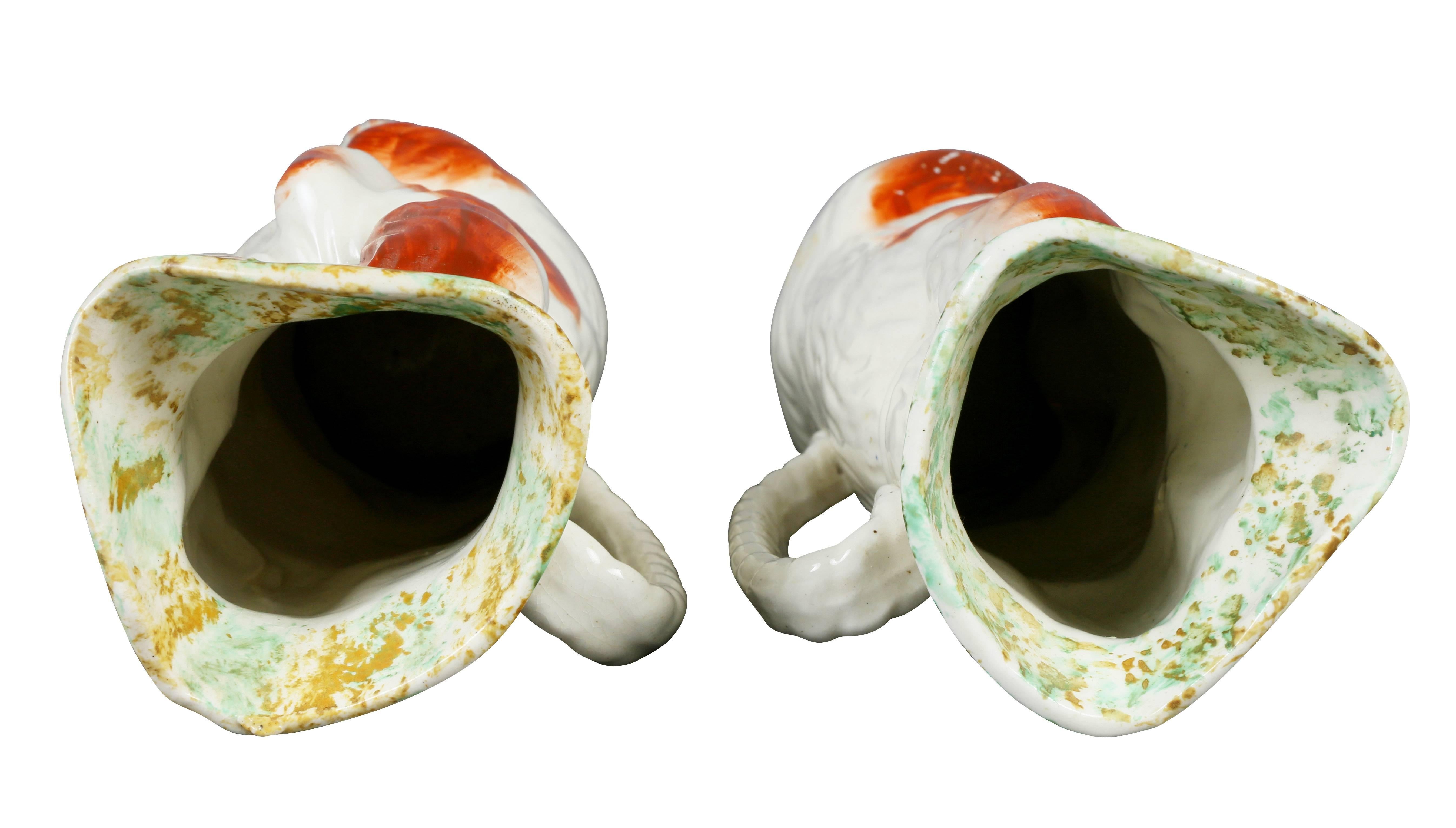 Mid-19th Century Pair of Staffordshire Spaniel Form Toby Jugs