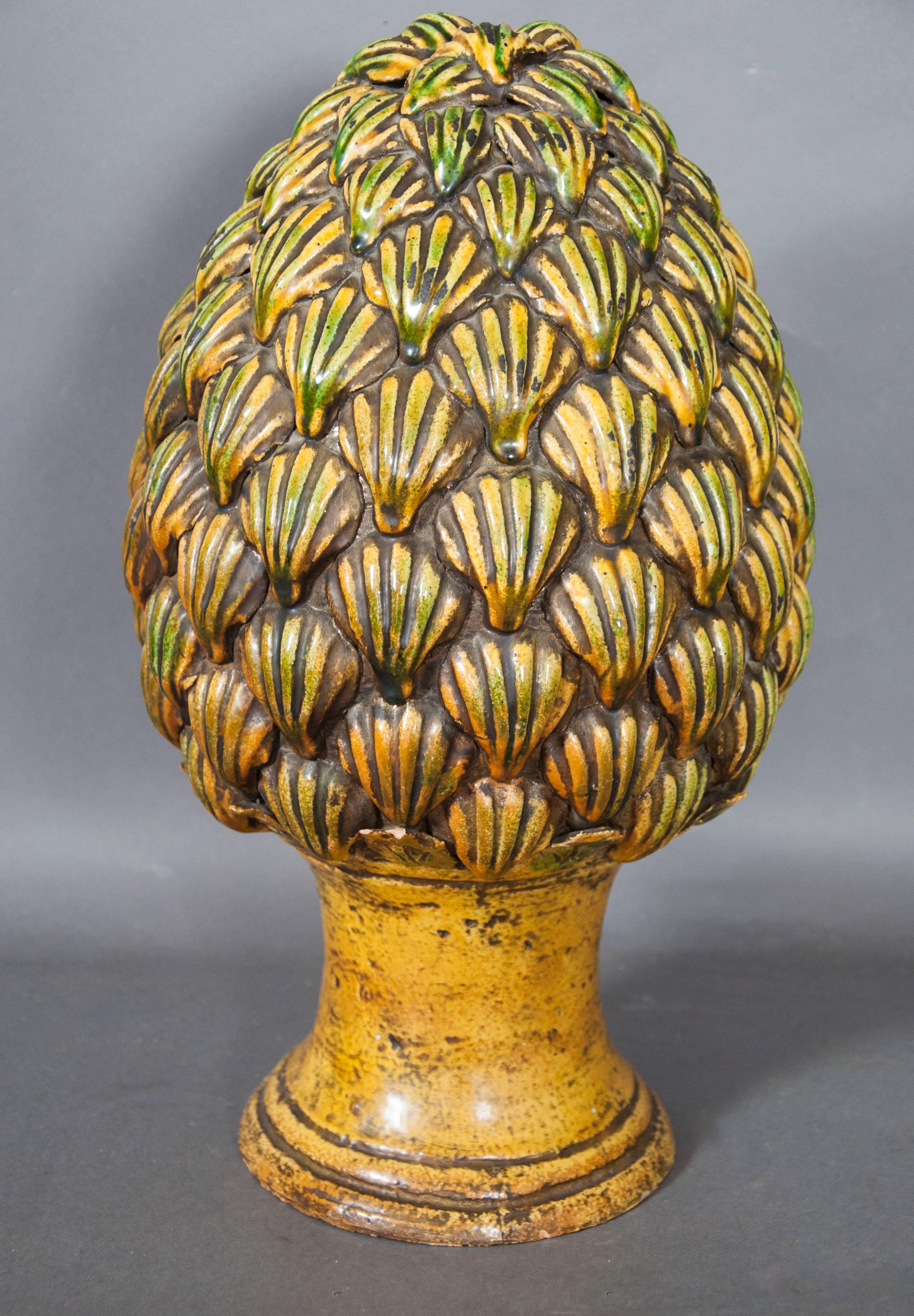 Decorated in yellows and greens, scallop shell shaped decoration, circular base.