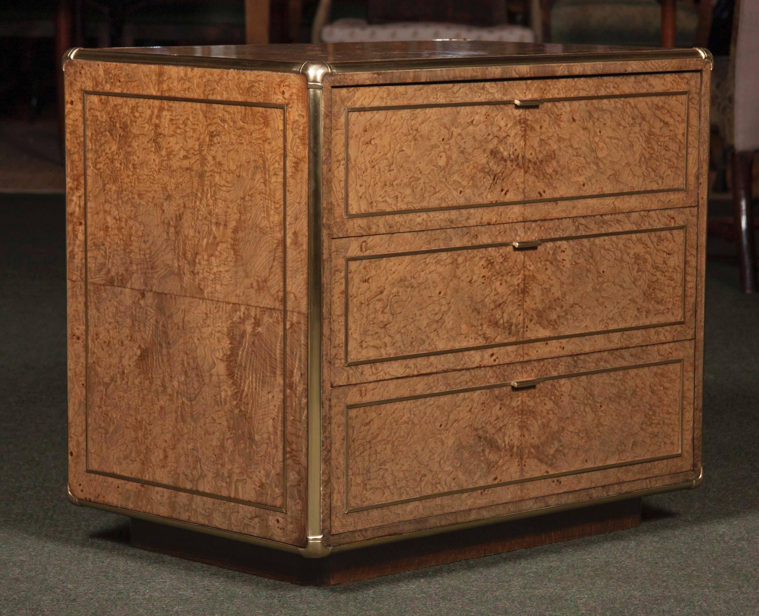 Pair of burl wood and brass-mounted Campaign style side cabinets. One with drawers and the other with doors and interior drawer. With brass edges and inlay.
