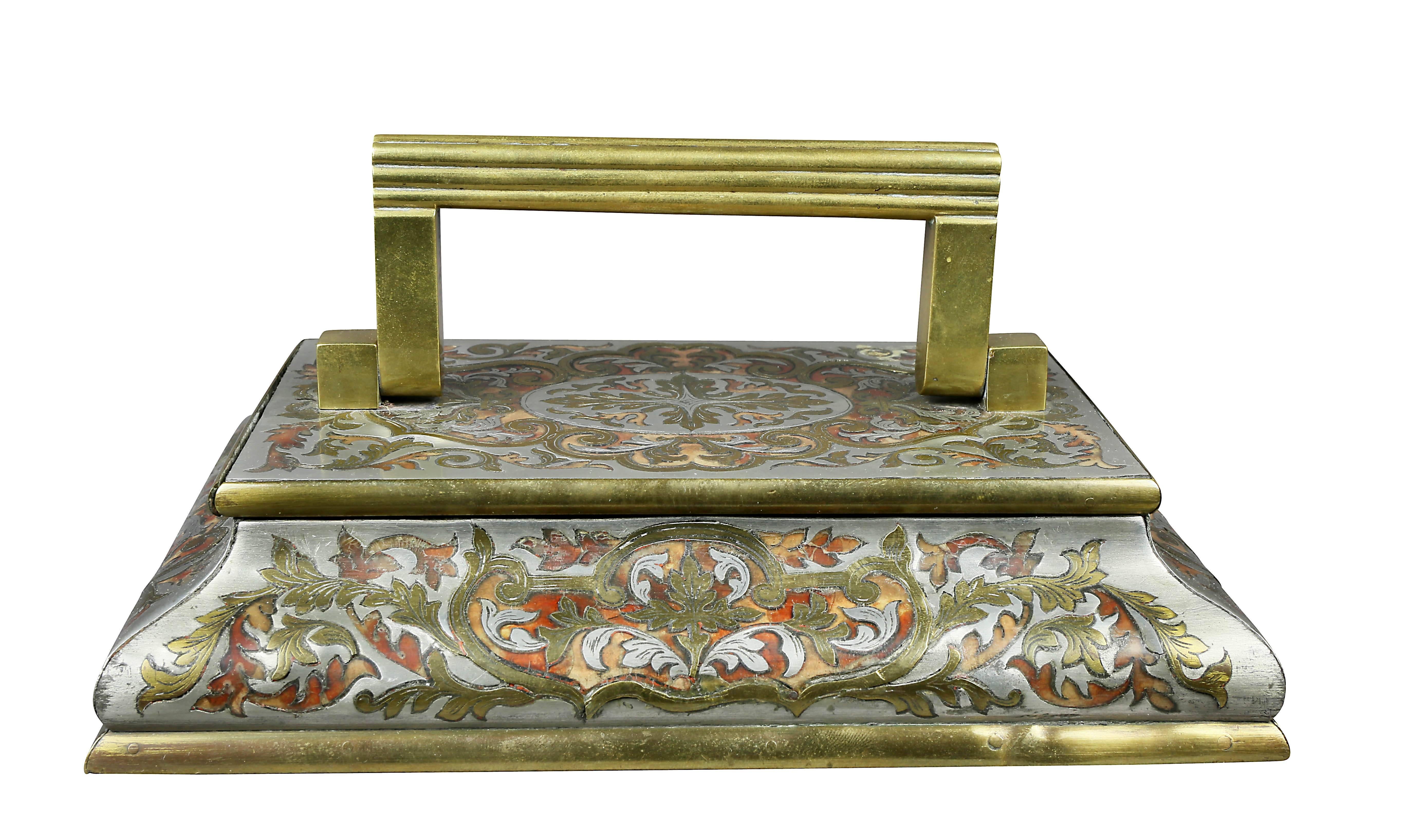 With rectangular handle and shaped rectangular stepped base.