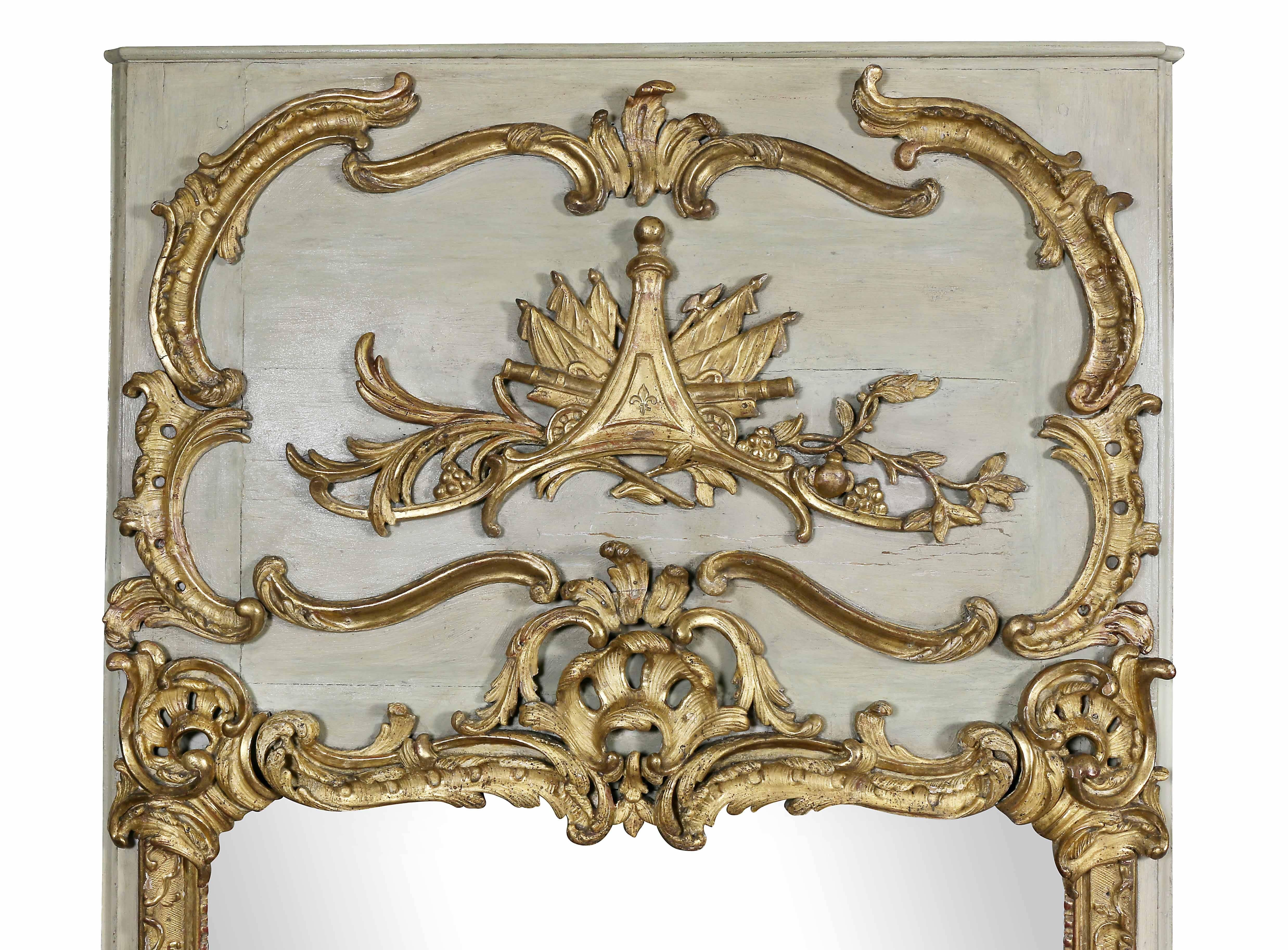 Each rectangular with painted ground and carved giltwood rocaille decoration with central military trophy with fleur-de-lis. Provenance; Fogg Estate, Chestnut Hill, Mass. Slight variations in carved decoration.