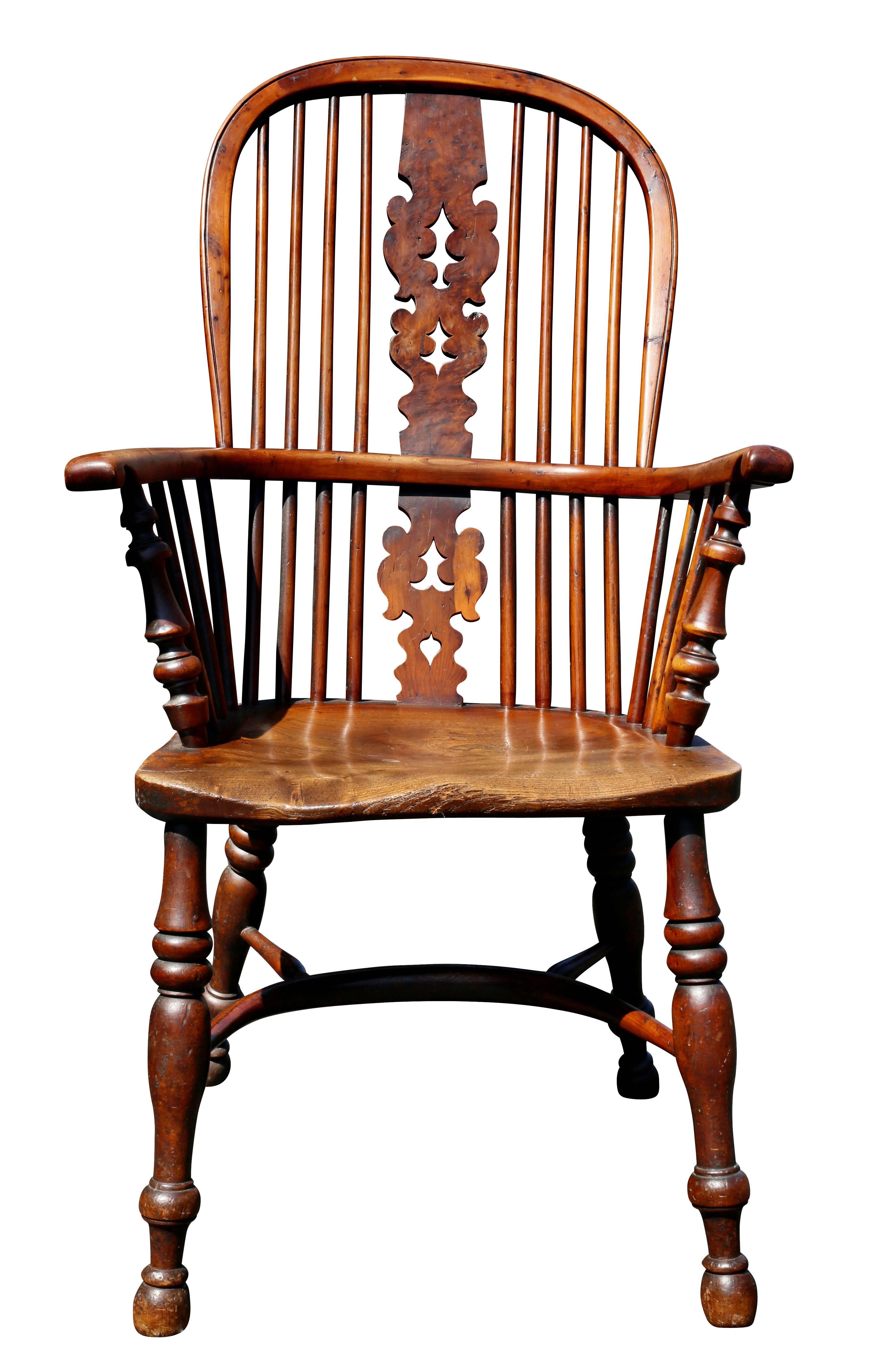 With arched back with central pierced splat flanked by spindles, shaped seat raised on turned legs with crinoline stretcher.