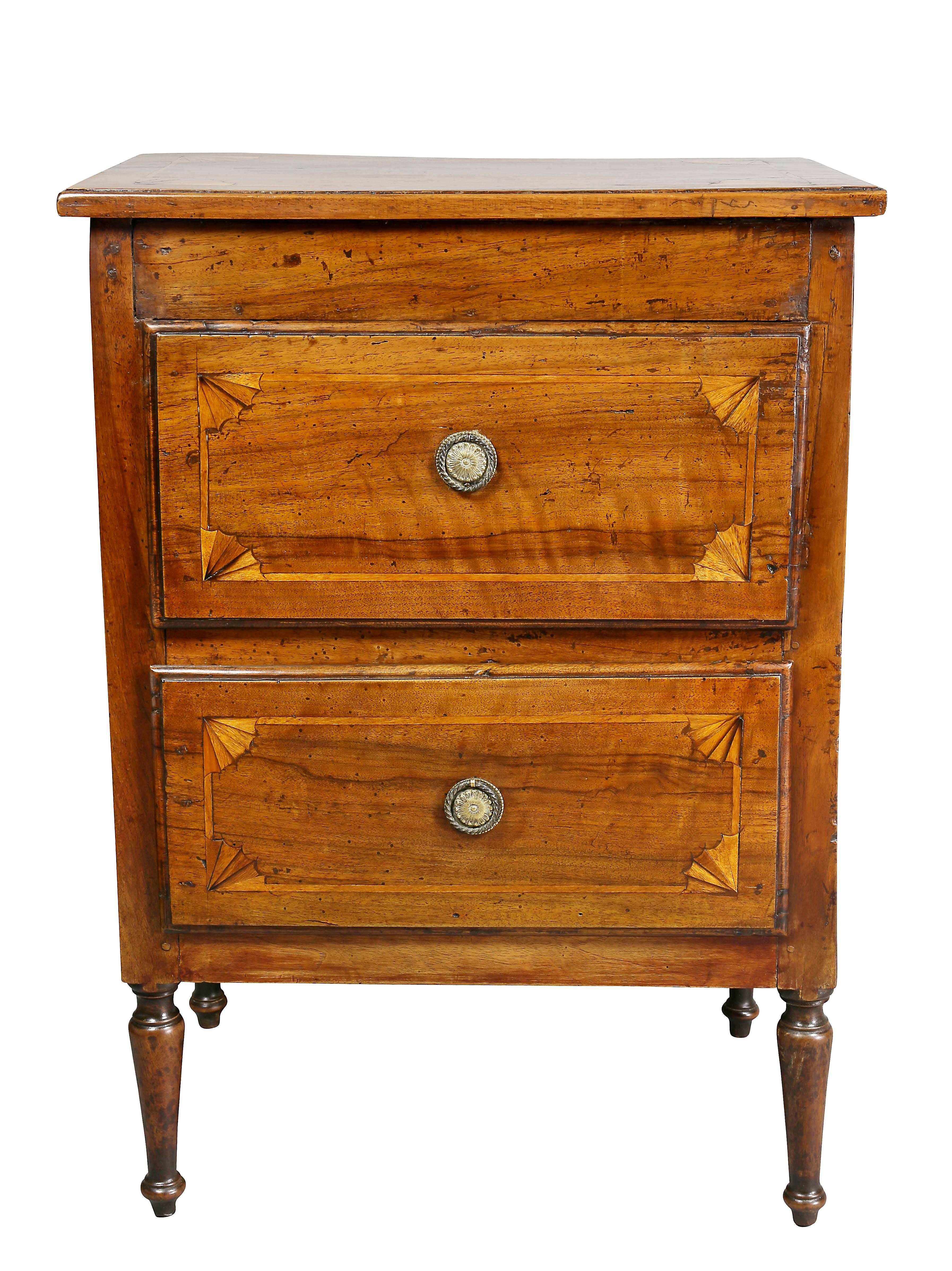 With rectangular inlaid top over two drawers raised on circular tapered legs.