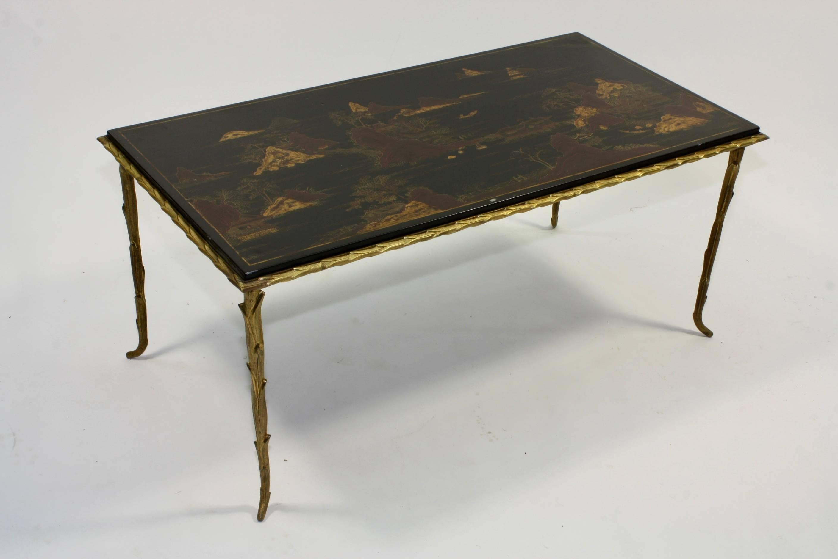 French black lacquered and japanned coffee table with gilt bronze mounts, acanthus detailing (Maison Baguès, mid-20th century).