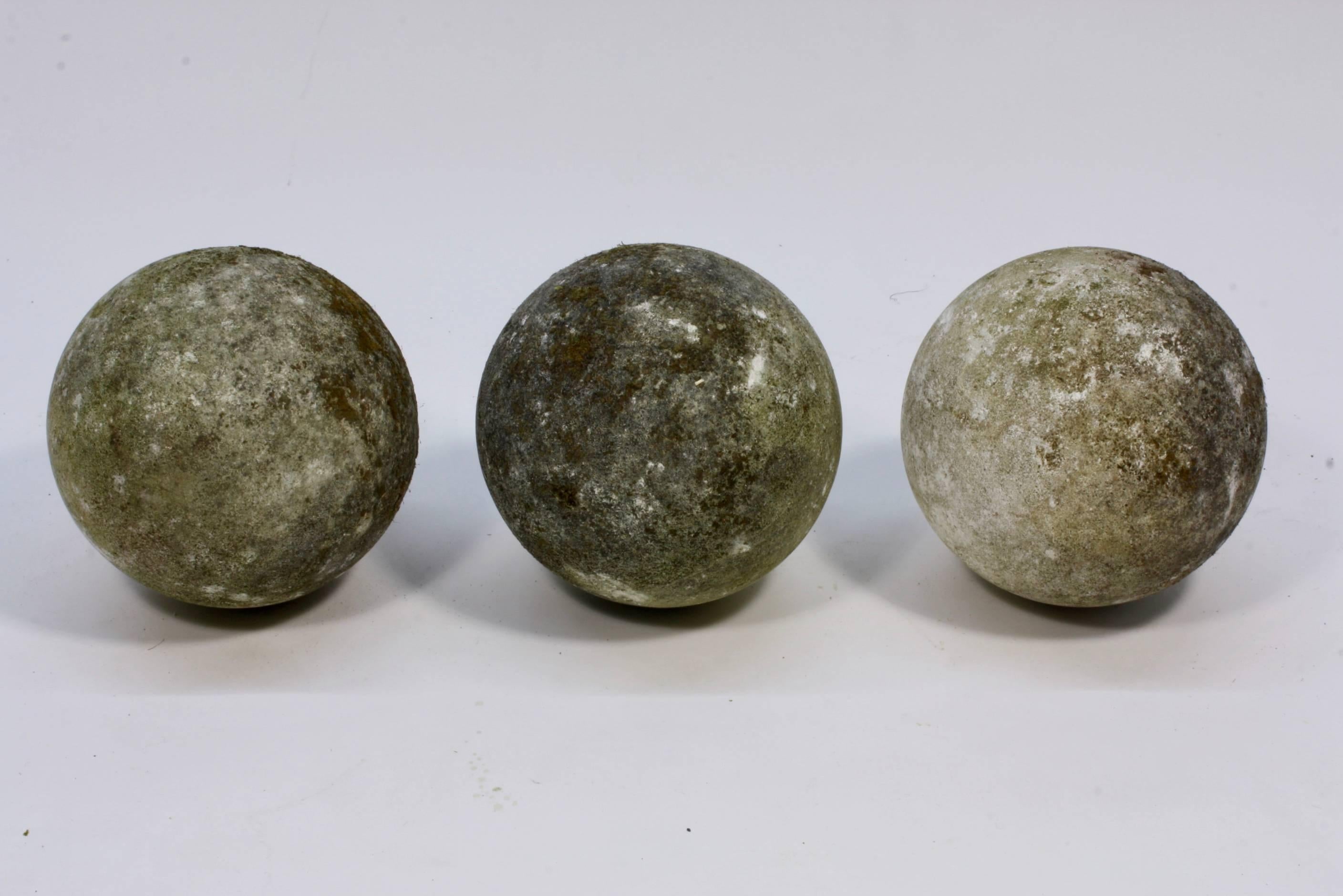 Set of three large French 19th century carved stone ball finials or garden elements (possibly cast stone). Could be used as finials on a gate pillars or a wall, or as interesting garden ornaments. Each sphere weighs approximately 50 lbs.