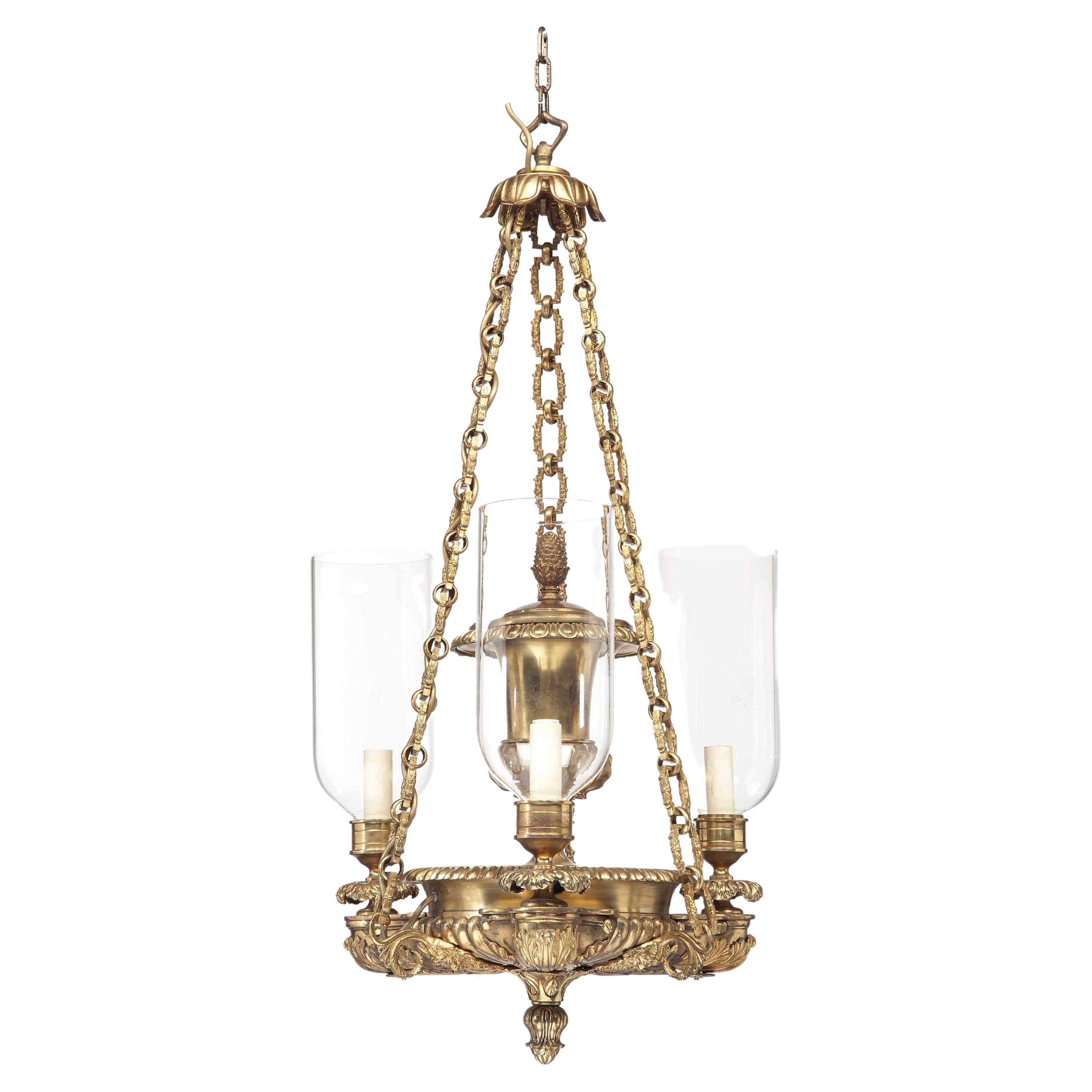 Set of Eight English Gilt-Metal Three-Light Chandeliers For Sale
