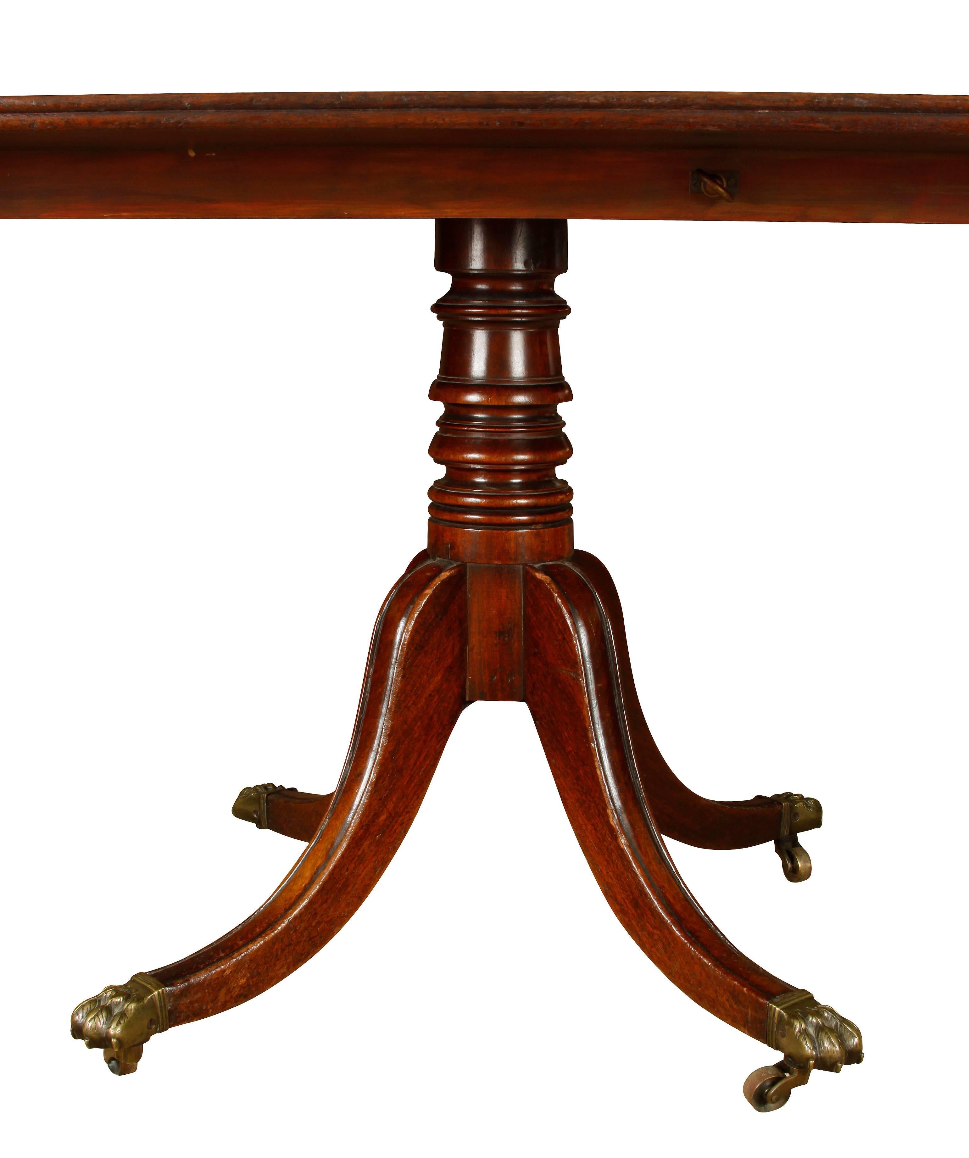 Although some believe that "brown furniture" is out of style, quality and craftsmanship stand the test of time. This English tilt-top mahogany breakfast table is a fine example of premium English furniture. With beautiful details, such as