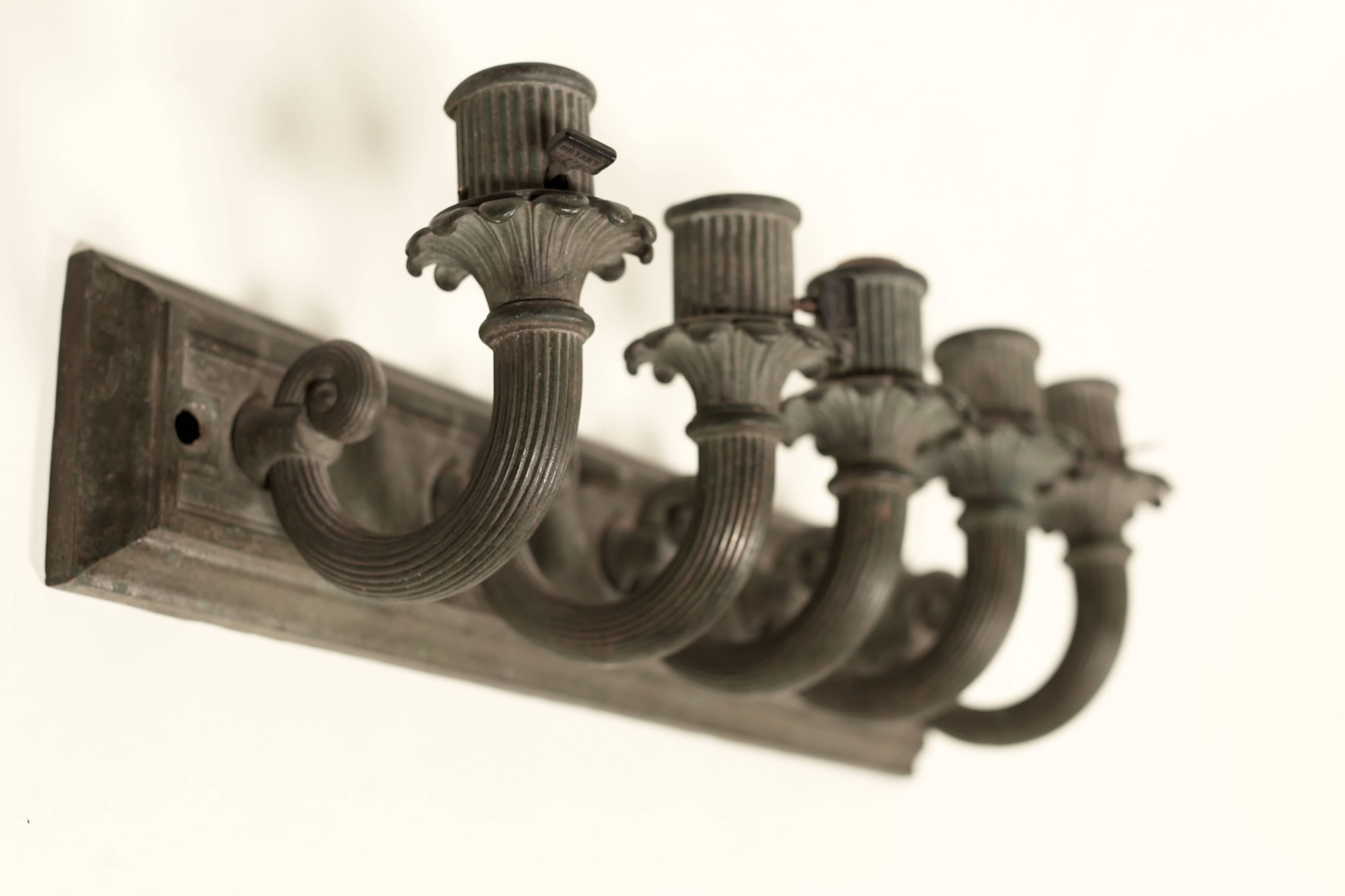 Pair of early American five-light candelabra sconces, circa 1910. Bronze; original patina. Wired for US standard bases.
