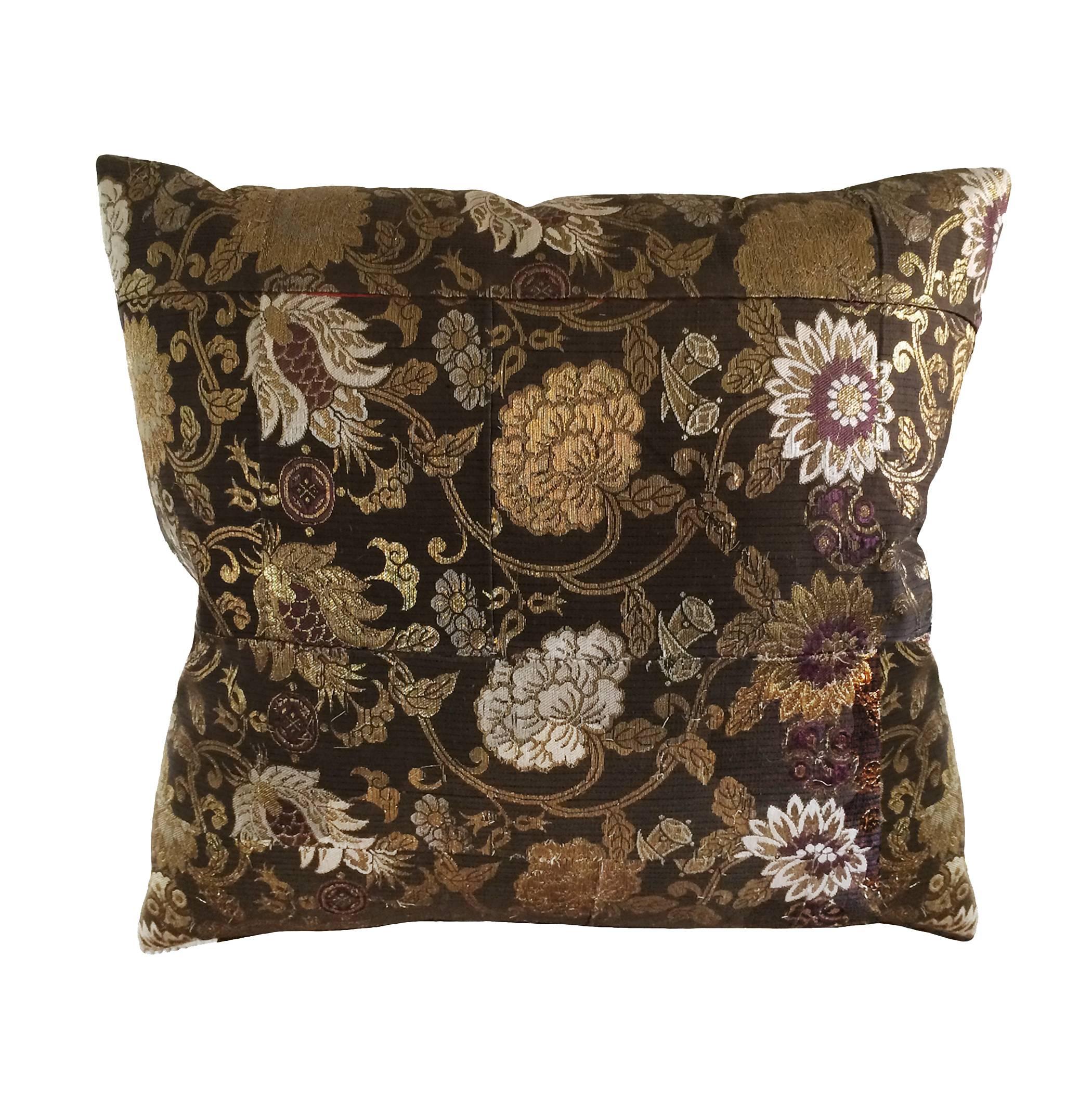 Custom Japanese Obi silk down pillow with red medallion emblem on one side and floral background on both sides; 19th century.