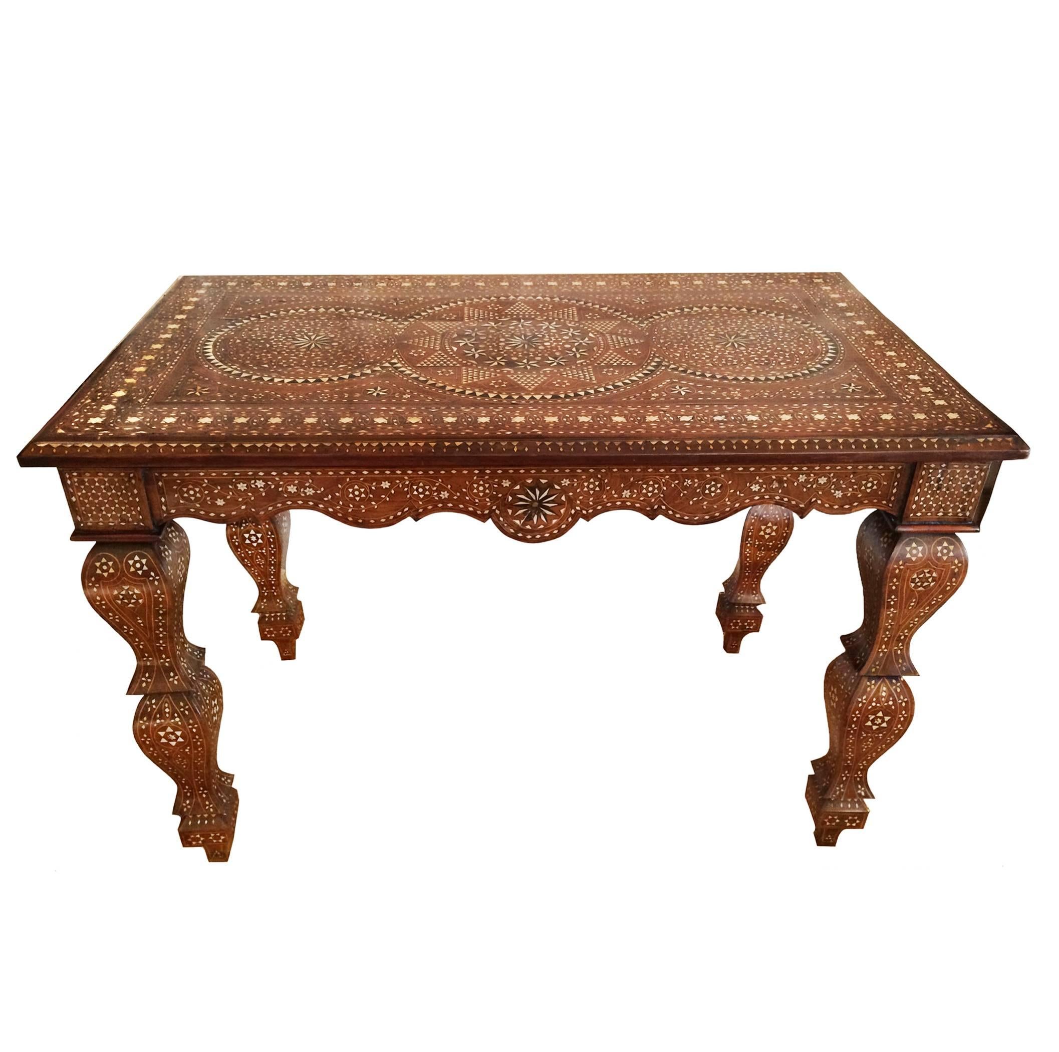 Hand-carved Italian inlay walnut table in the Baroque style; intricate bone inlay; scrolled apron leading down to exaggerated shaped balustrade legs, 19th century.


  