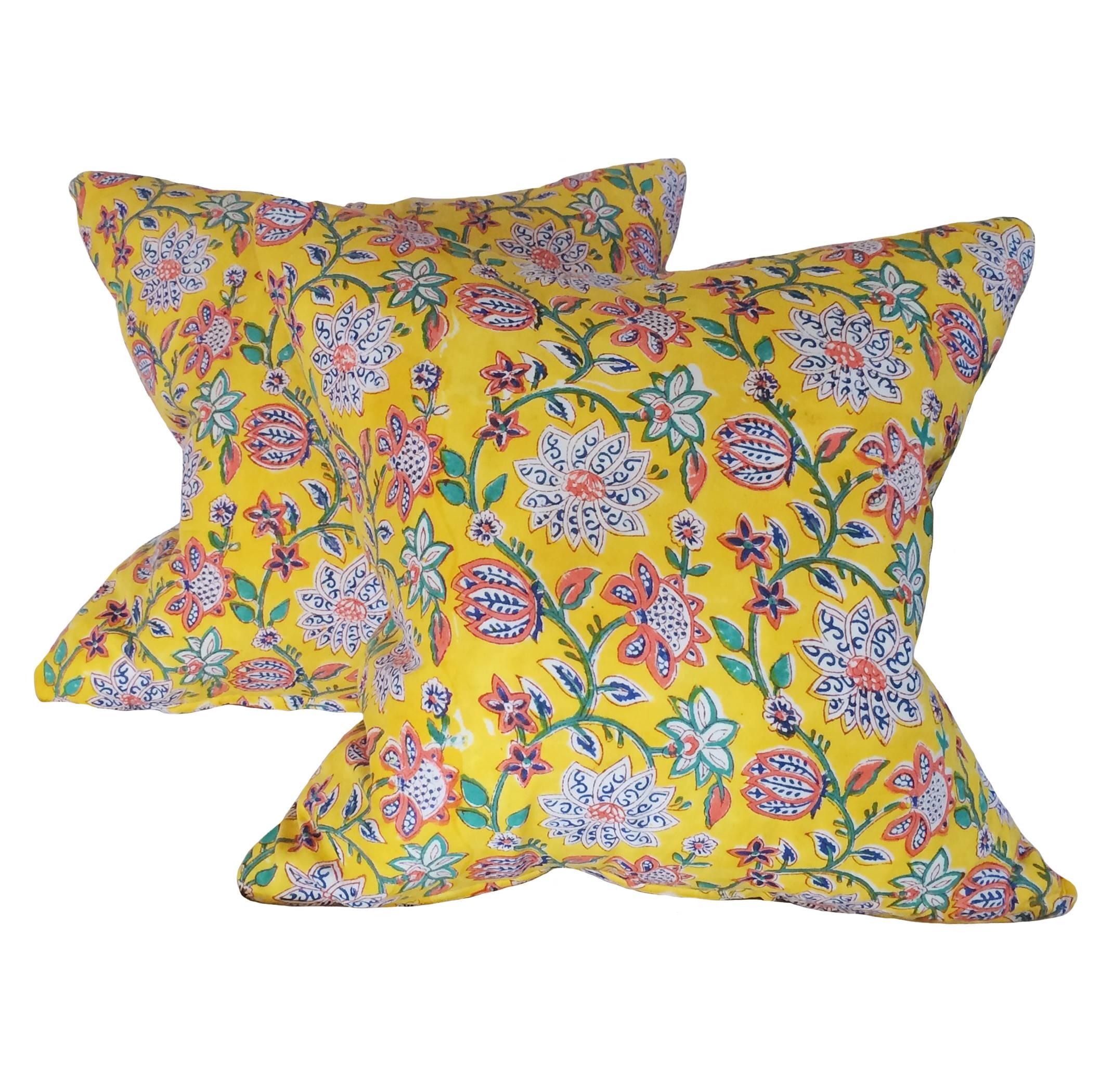 A pair of vibrant yellow cotton Indian Batik down pillows with a floral pattern; vintage batik fabric on both sides; 19th century. The cotton as soft as a baby's bum.