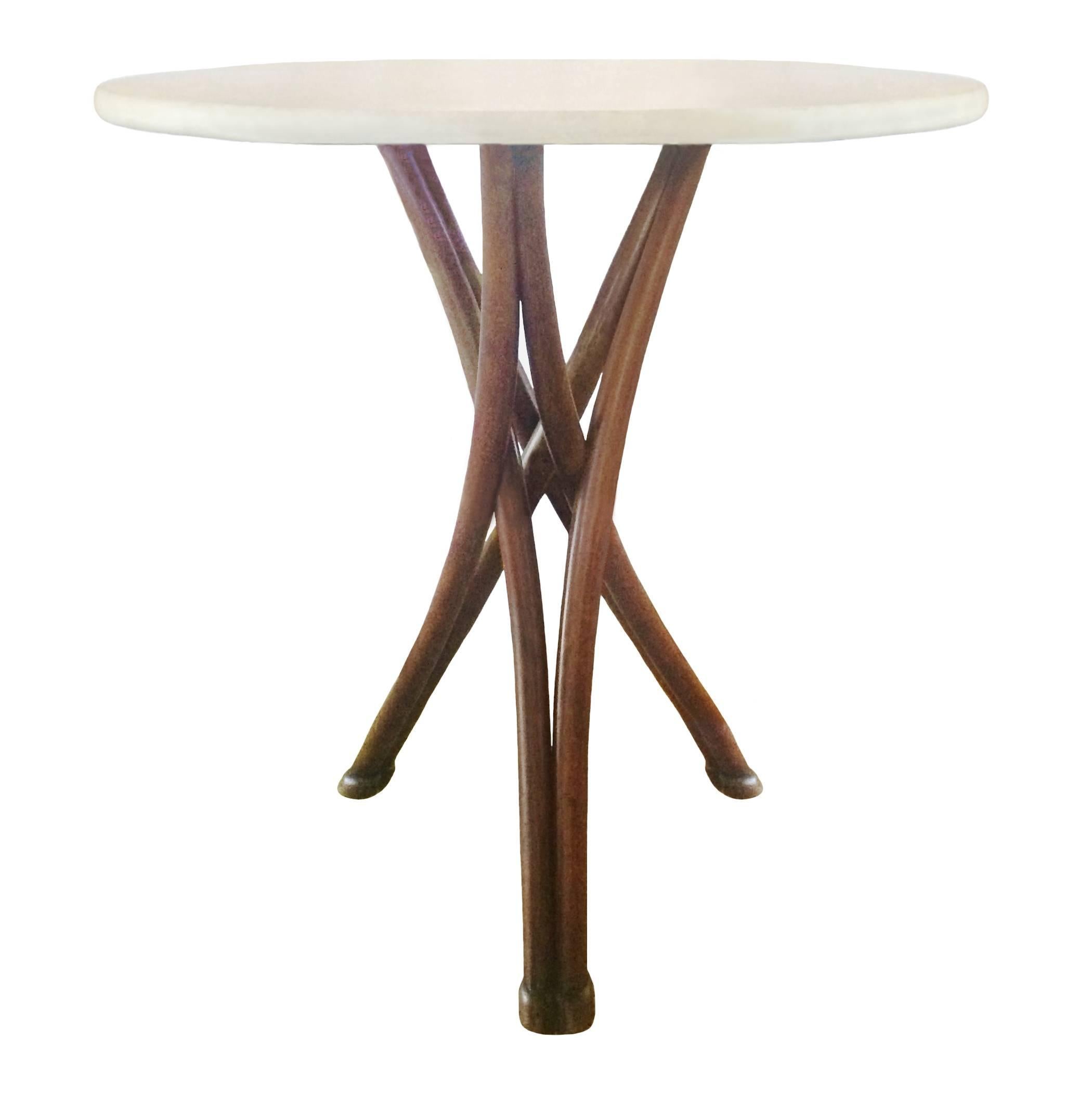 Thonet bentwood table with white marble top; criss cross intersecting tripartite base, Austria, 19th century.

  