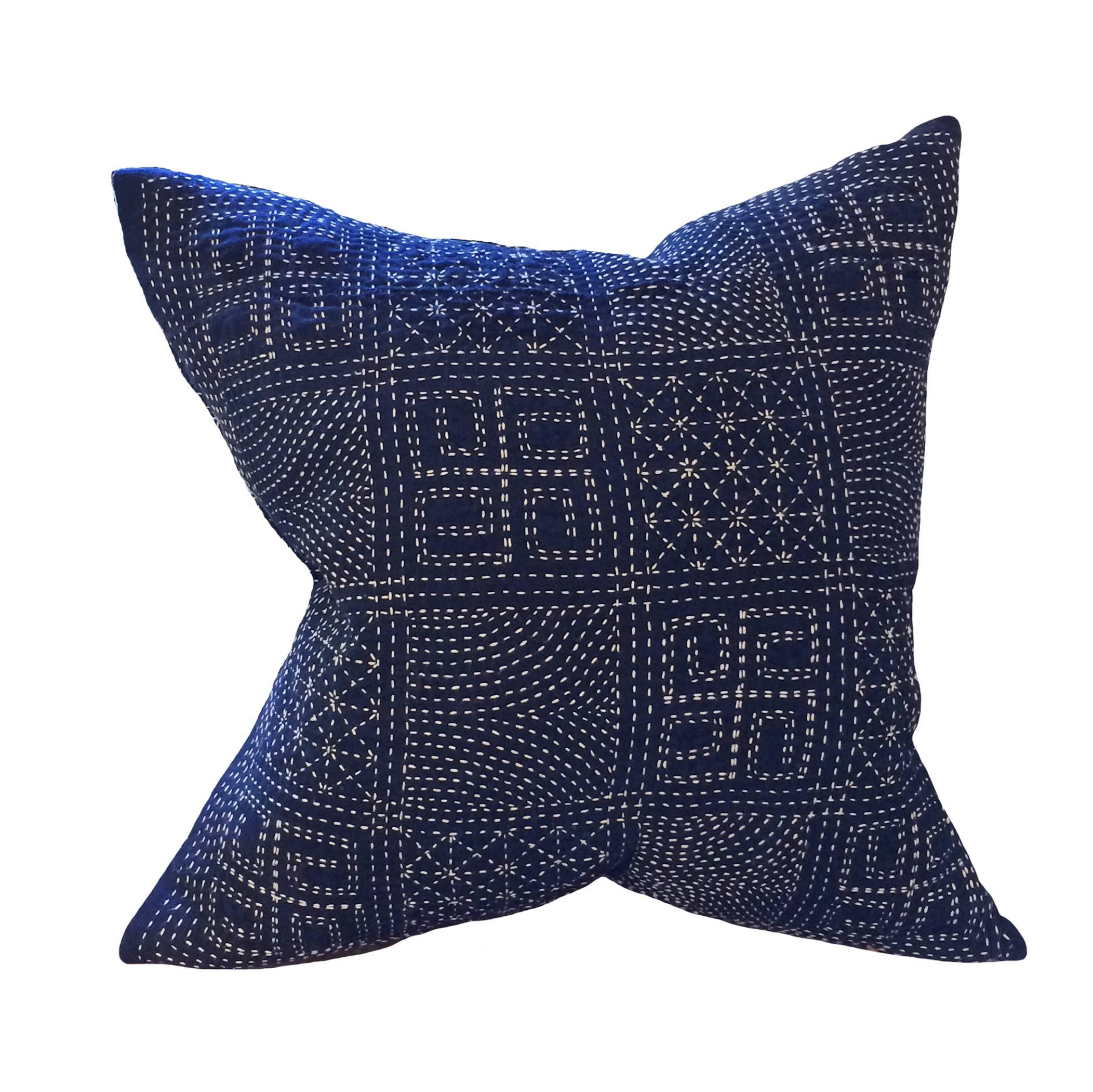 A pair of vintage Japanese Indigo Embroidered down pillows; a series of patchwork hand-sewn scrolls, dots and stars; natural linen on backside; 19th century.
 