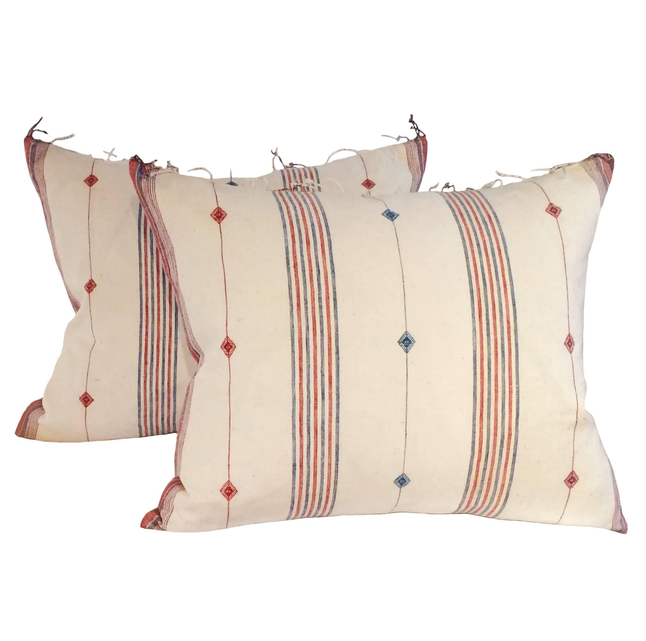 Pair of custom red, blue and ivory striped cotton down pillows with fringe, India, Mid-Century. Made from vintage scarves; reinforced with backing. Vintage fabric on both sides.