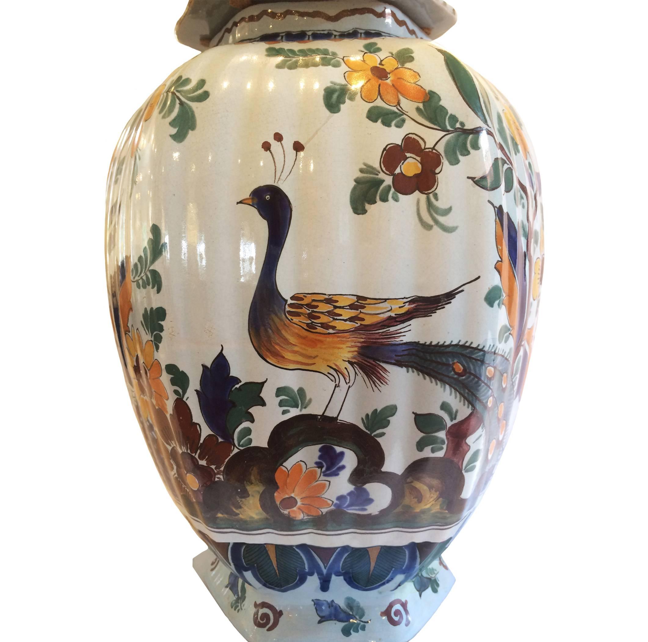 Delft polychrome tin glazed lobed fainece covered urn; peacock, floral and bird motif, 19th century.