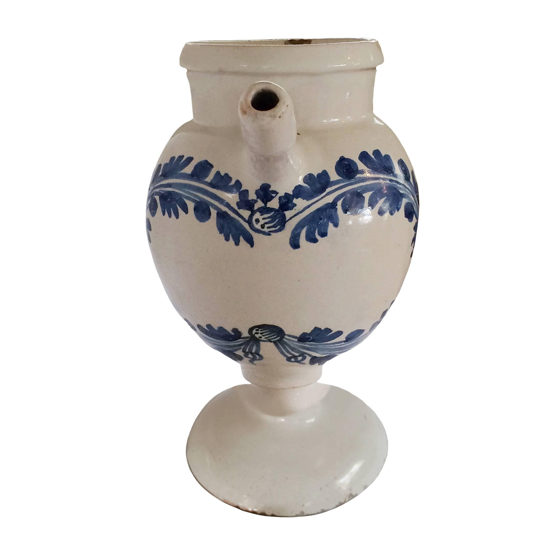 French faience never pitcher; adorned with garlands, 17th century.
   