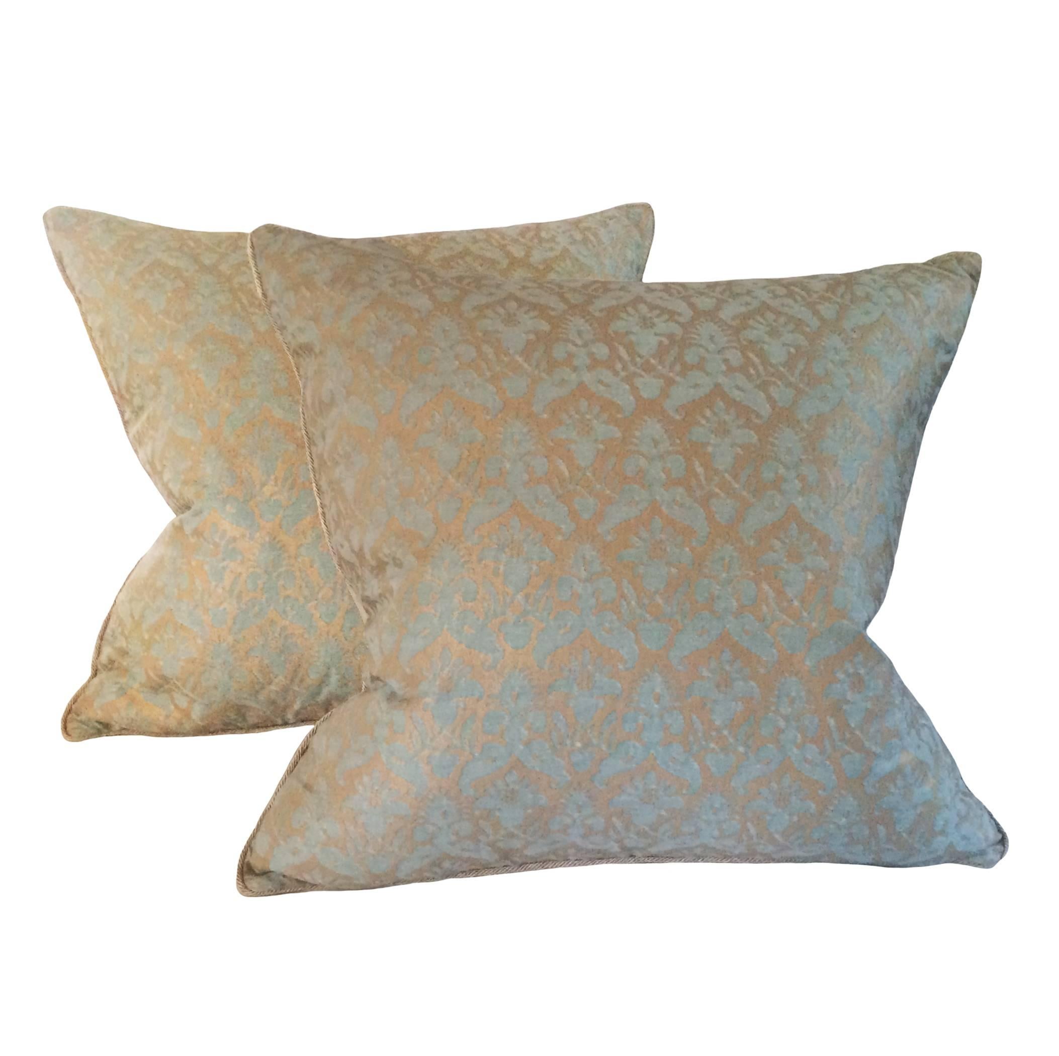 Pair of custom aquamarine and silvery gold Delfina Fortuny down pillows.

 