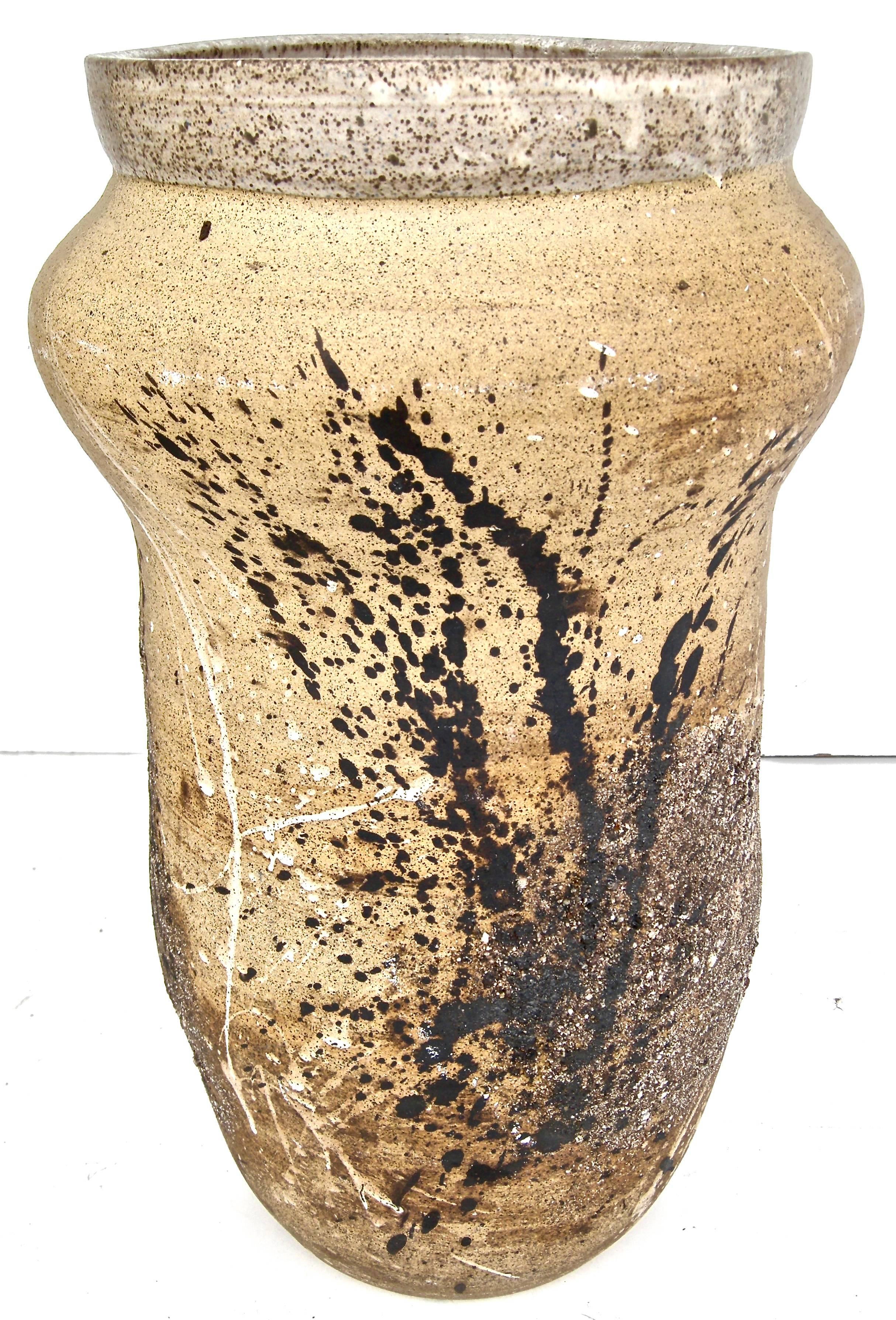 Beautiful large-scale, handcrafted/thrown, Mid-Century, artisan pottery vessel. Having a splattered, foliate inspired overall design and aesthetic. Soft overall earthen surface and patina.