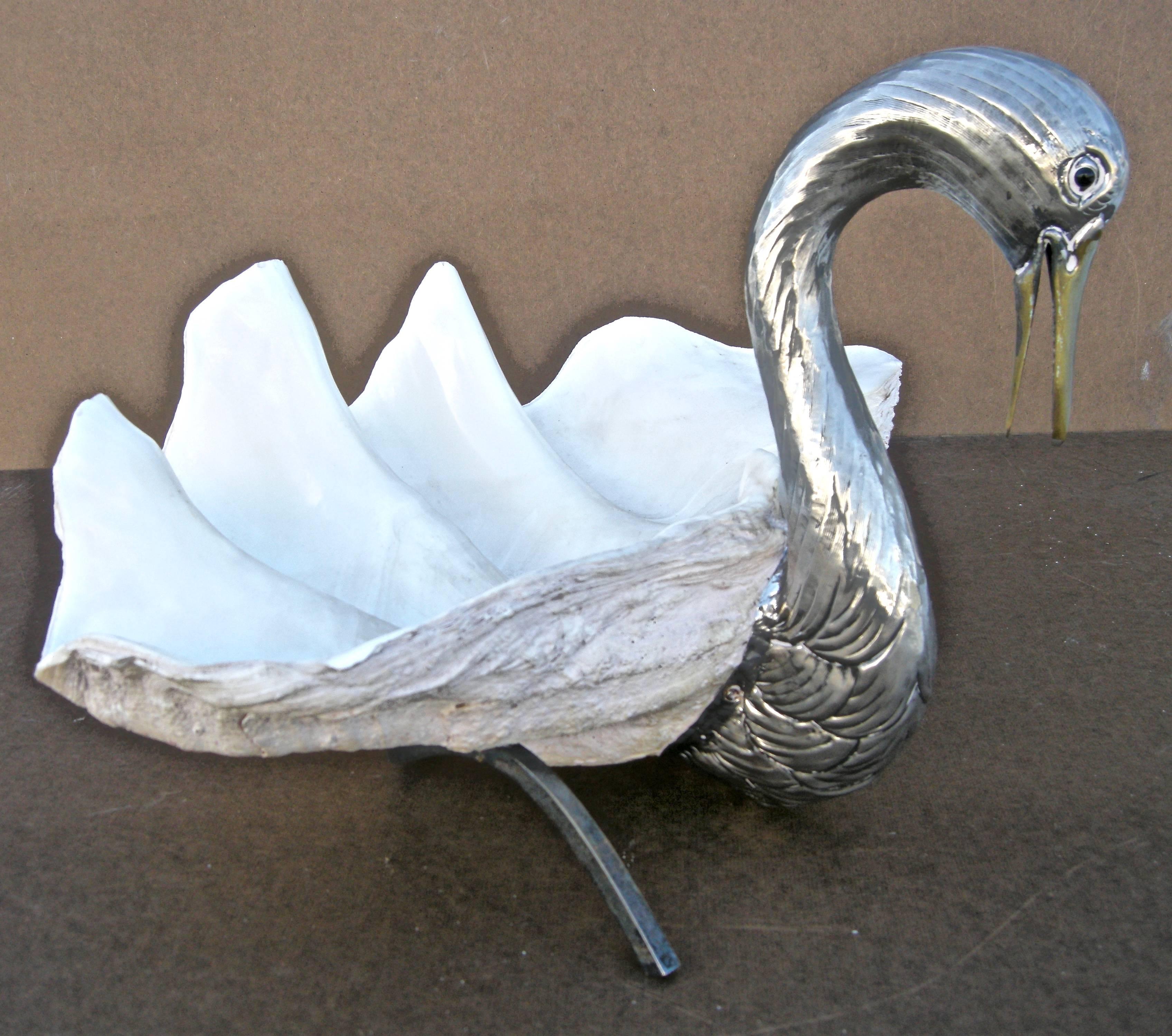 Elegant, vintage, handcrafted, Modernistic-style swan with attached natural clam shell. Silver plated brass body resting on unusual and distinctive, curvaceous square-tubular flowing legs. A beautiful sculptural standout. Attributed to Italian