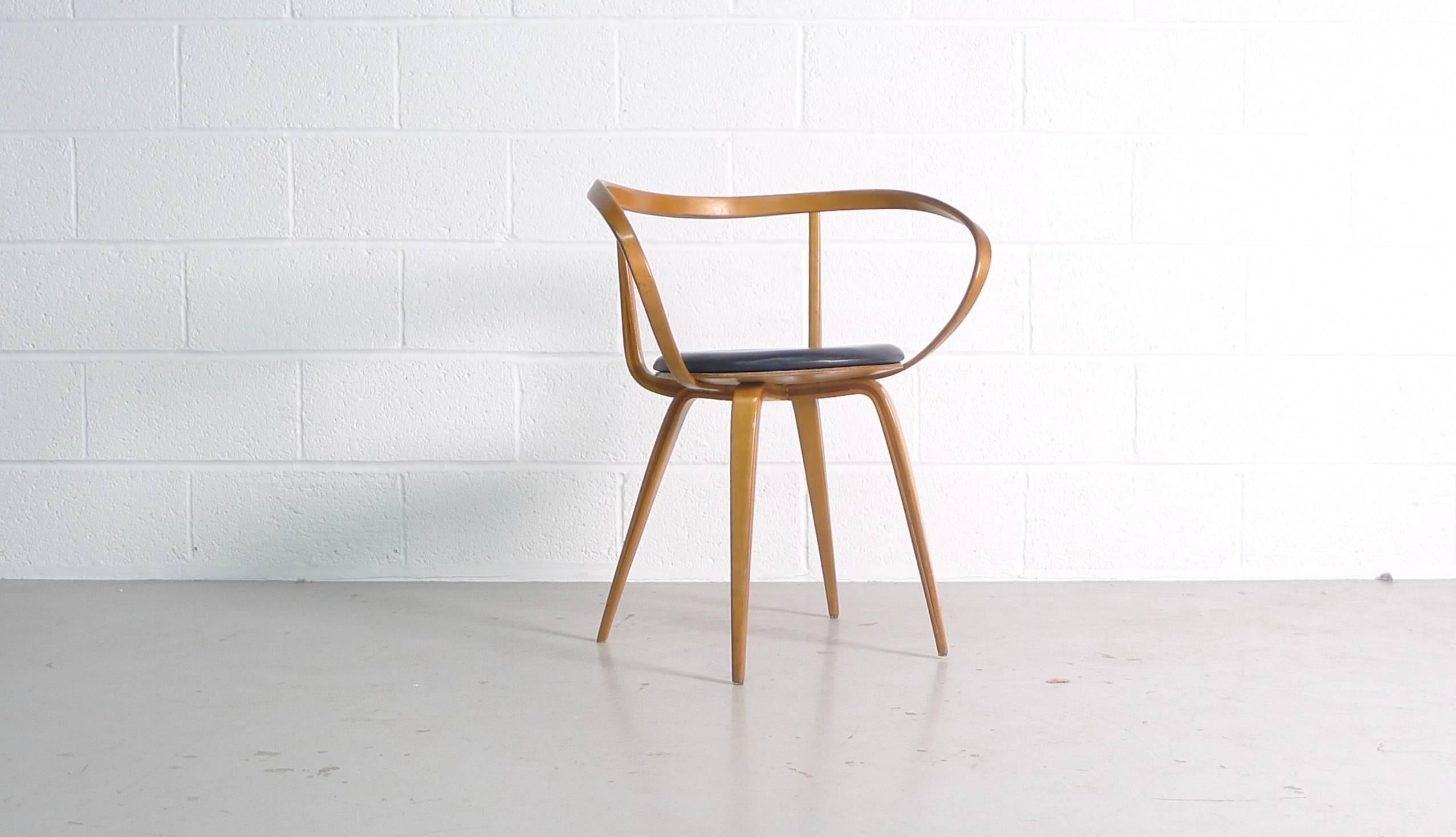 George Nelson / John Pile for George Nelson Associates, model no. 5891 , a rare Pretzel chair circa 1957 and produced for a very short period.
Leather seat pad and wood frame in excellent condition.
 