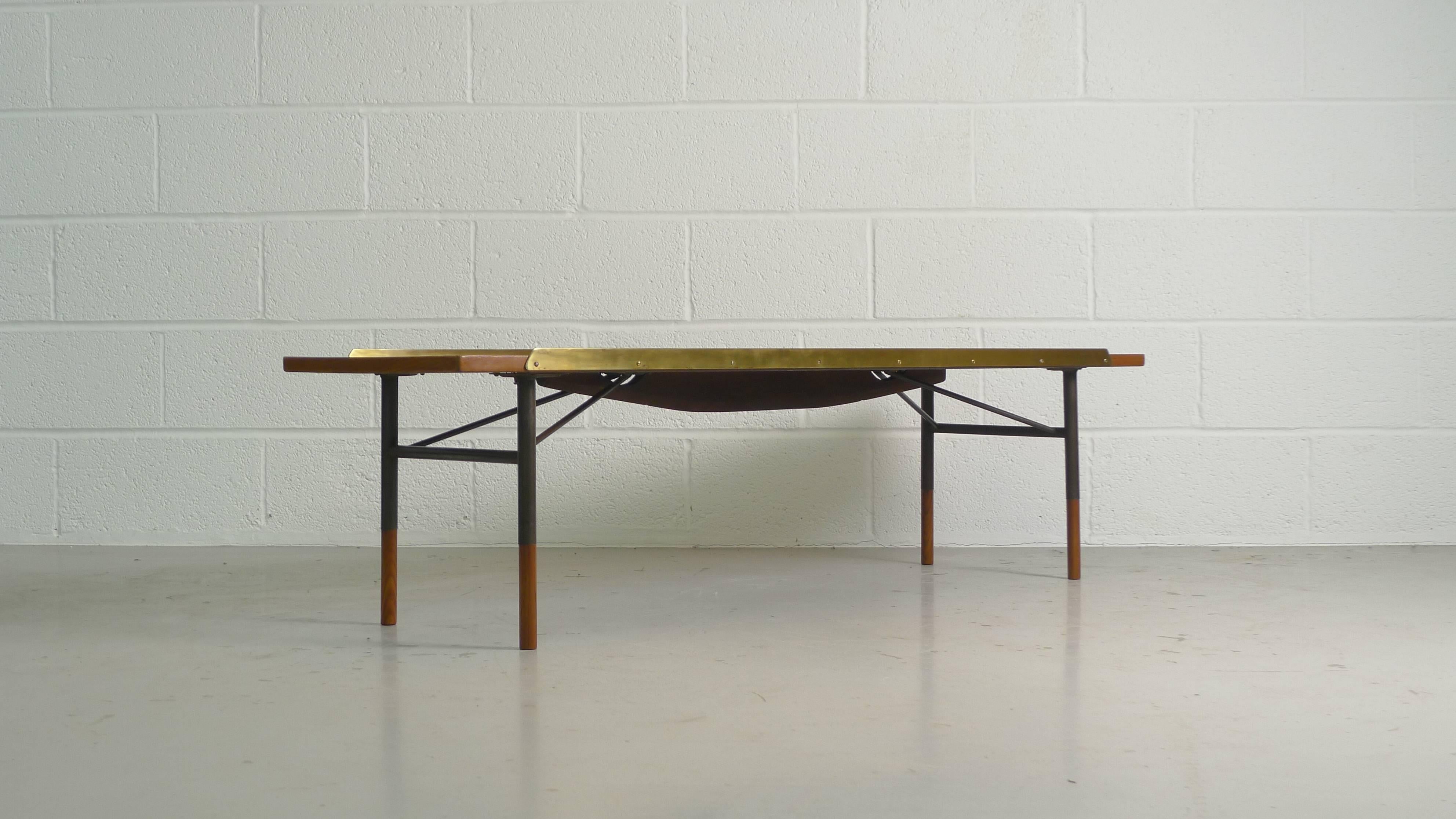Finn Juhl for Bovirke, Denmark, 1952 . A bench or coffee table with stunning teak top , wood and steel subframe supported by teak leg cappings. Top has brass siderails to contain cushions or prevent items sliding off. 

A rare Juhl table in
