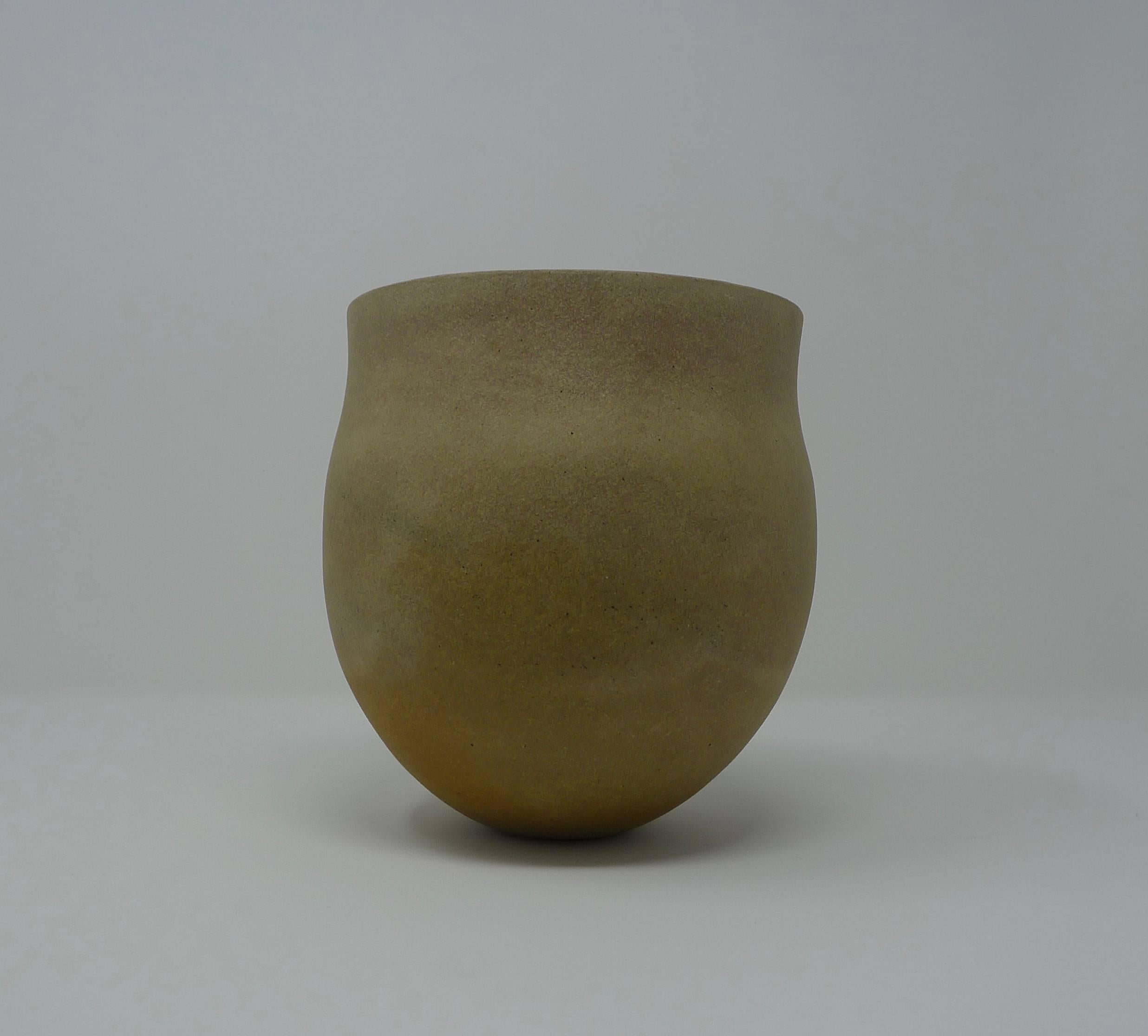 Jennifer Lee, British, b 1956. Stoneware pot, circa 1987, integral colors of mottled pale browns and yellows, with darker streaks and soft black speckle.

Perfect condition with no damage or restoration.