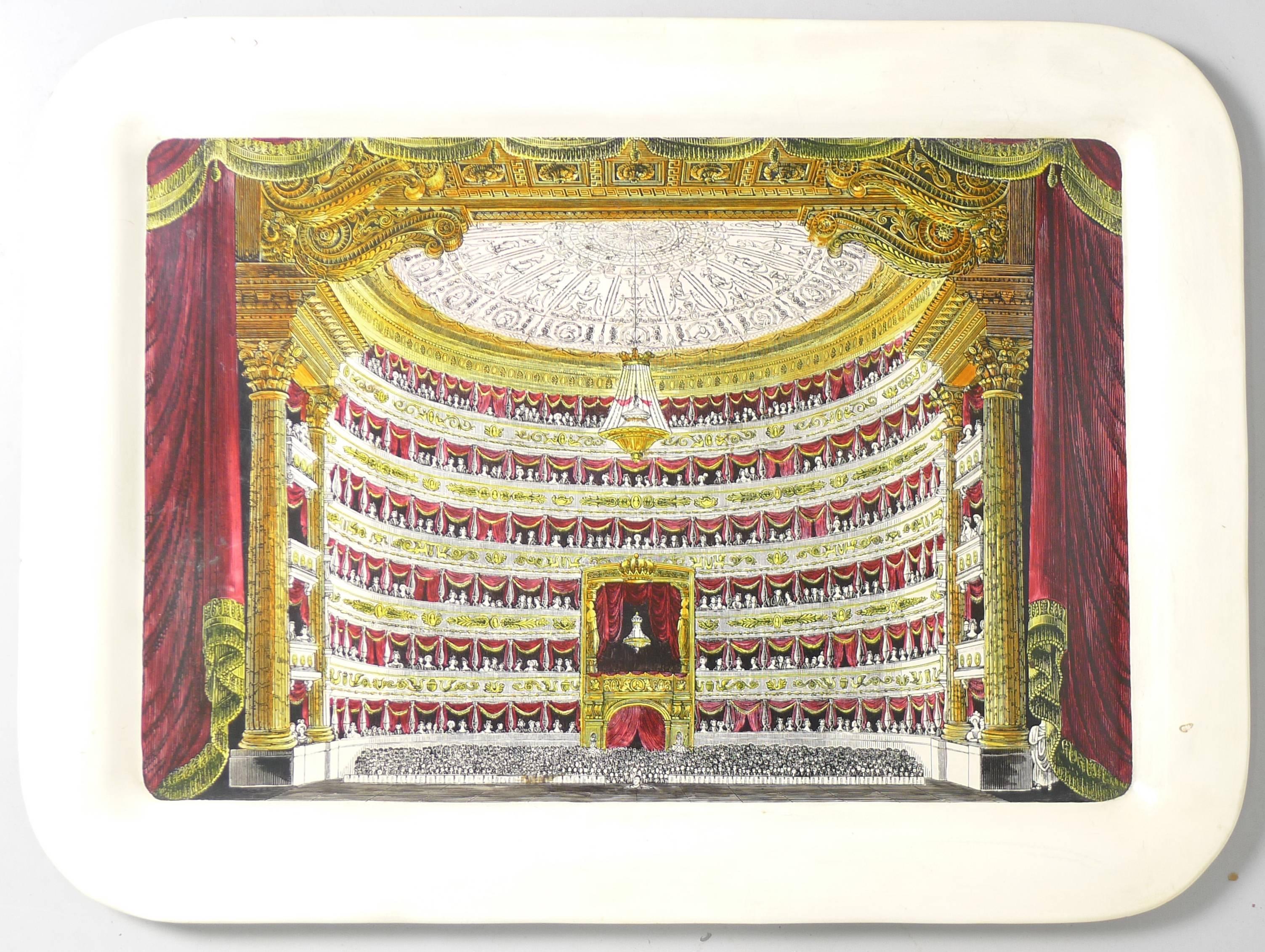 Piero Fornasetti butlers tray and supporting metal base. Tray depicts the scene in a large theatre as viewed from the back of the stage, underside of tray with designers label applied. Legs are metal painted in cream and featuring the trademark