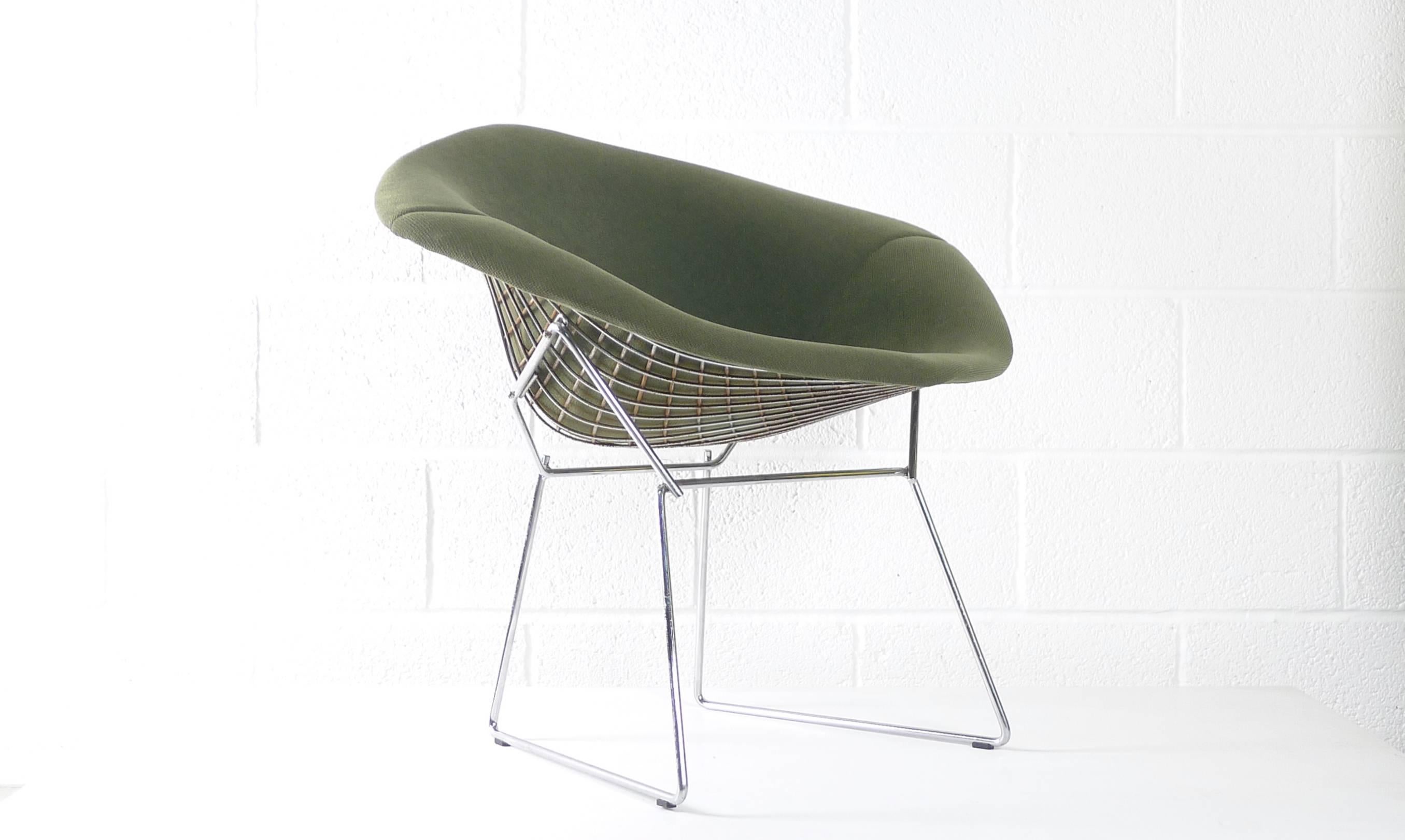 Harry Bertoia for Knoll International, 1960s, chromed steel frames supporting upholstered seat cushion. Knoll labels to underside. Available in in green and red as shown, also slate blue. Several of each available. Genuine examples manufactured in
