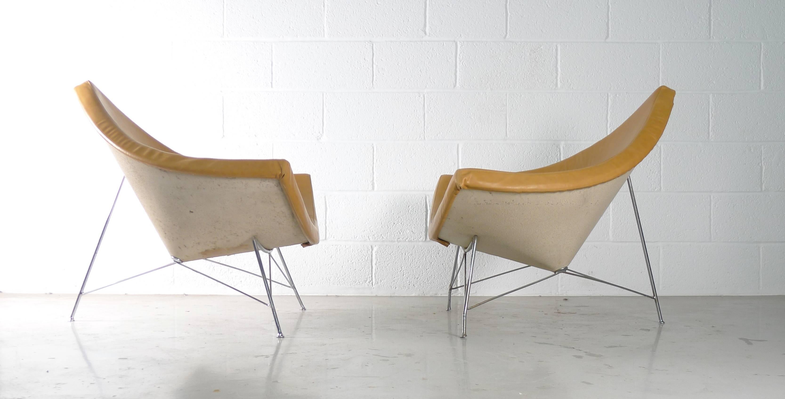 George Nelson for Herman Miller, USA, 1956. A pair of early examples from the first series of production, both professionally reupholstered in high grade soft tan leather. Frames of enameled steel and legs of chromed steel.

Labels to underside of