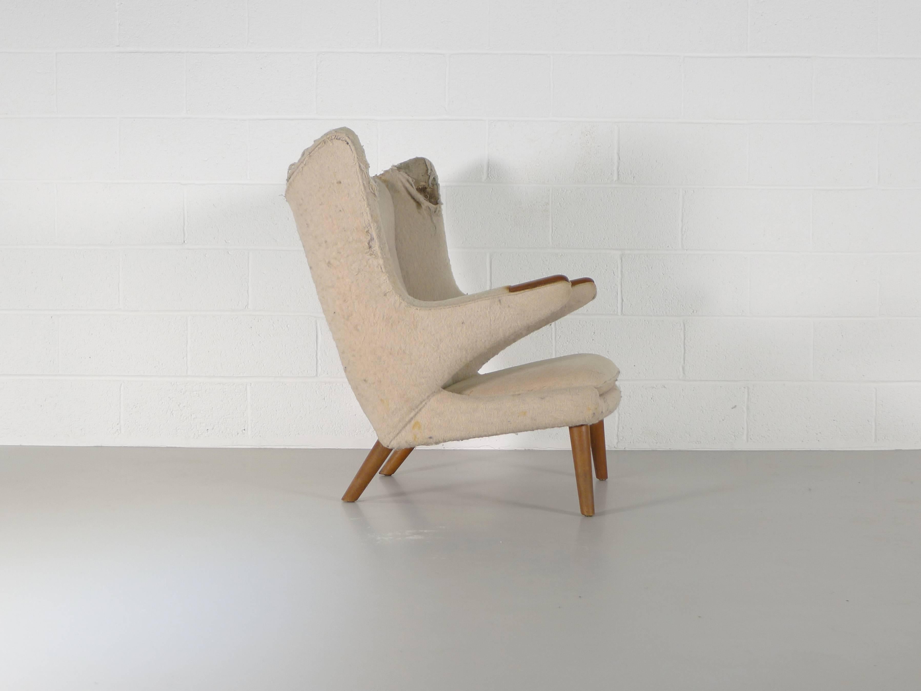 Hans Wegner for Johannes Hansen / A P Stolen, Denmark, 1950. A Papa Bear chair, structurally sound with nice teak paws. In need of re-upholstery to suit your taste and decor. From the same house as the AP 27 chair we also have listed and in similar