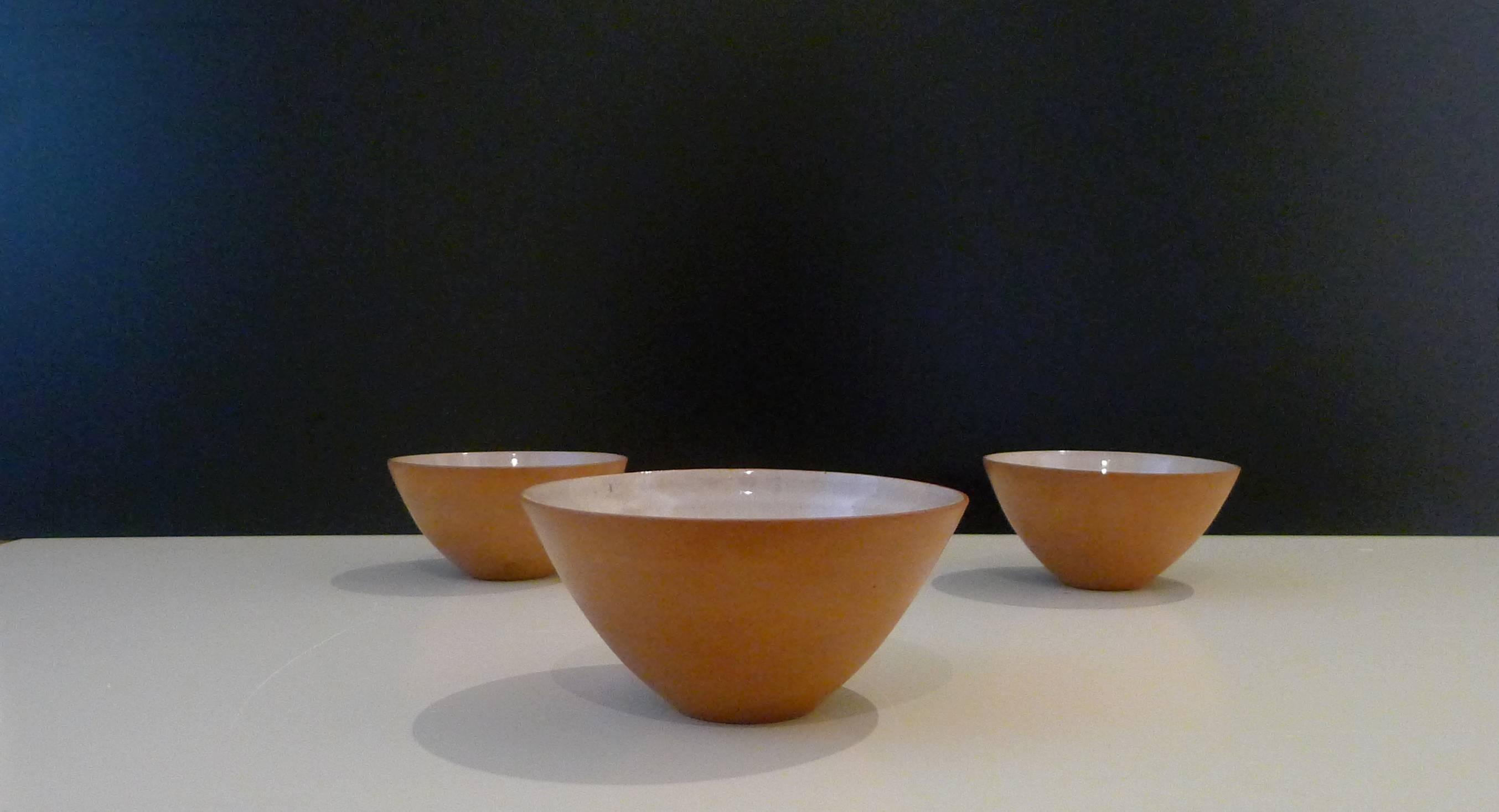 Lucie Rie, three earthenware bowls, circa 1949, very early examples of Rie's work as indicated by the chopmark signature on each vessel being on the exterior rather than the underside . 
Short firing crack to inside of largest