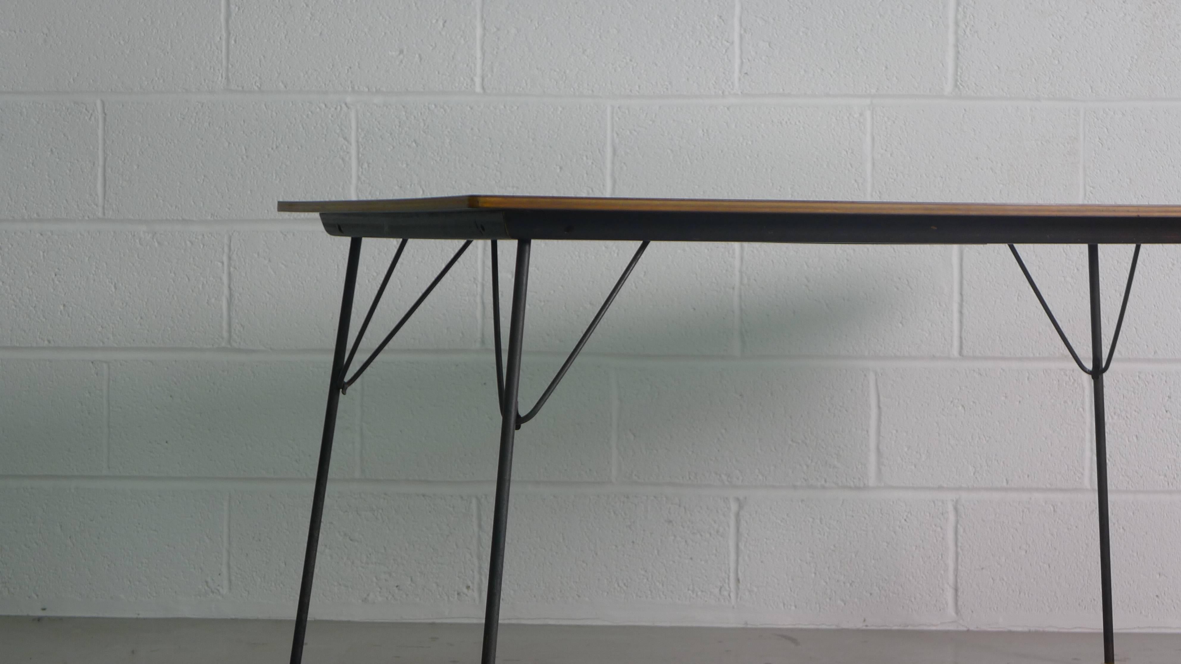 Charles & Ray Eames for Herman Miller, USA, 1954. A DTM-10 (Dining table metal), folding steel legs supporting ply top with white laminate. 

All in excellent order.