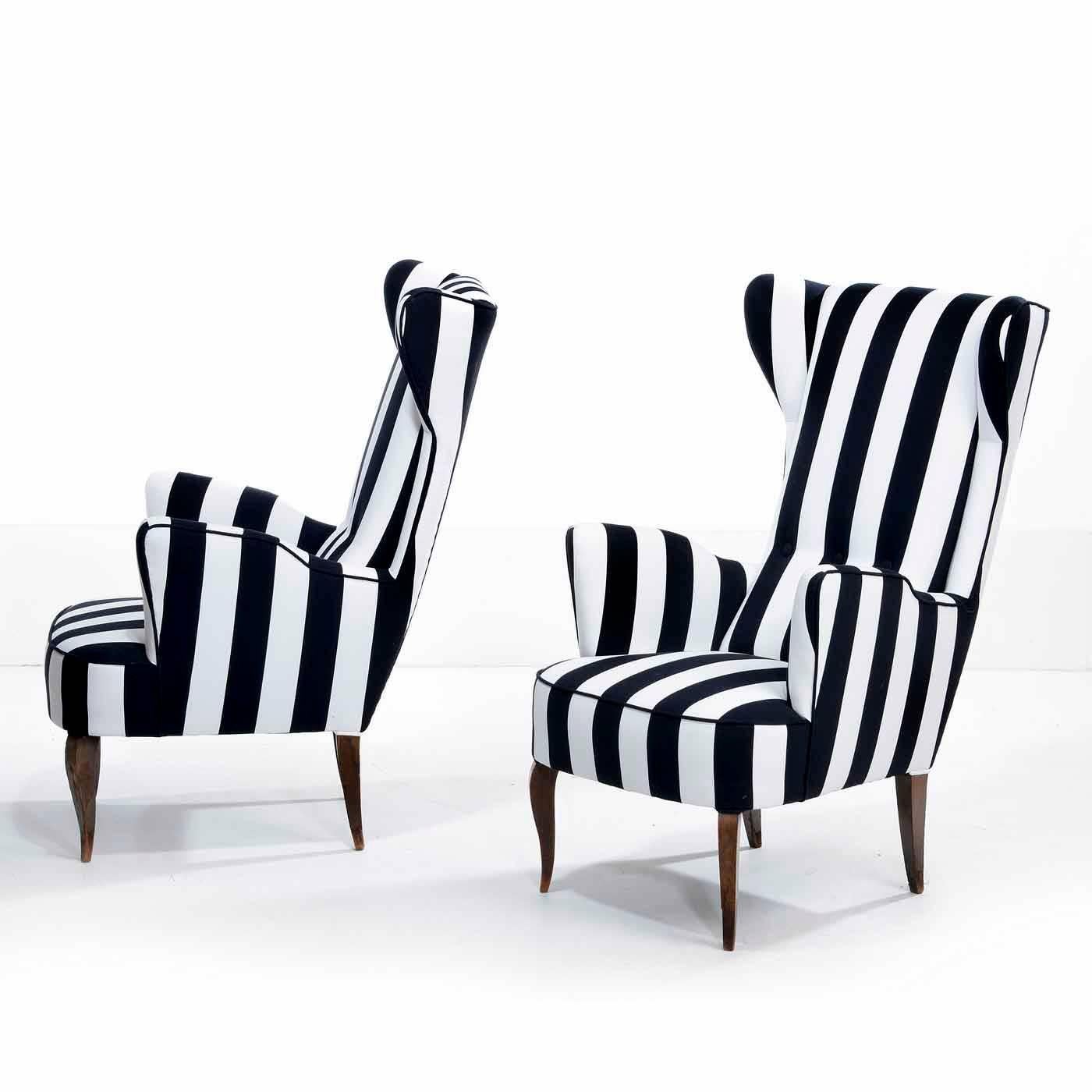 Pair of Italian club chairs with polished cabriolet legs. Reupholstered in striped cotton.