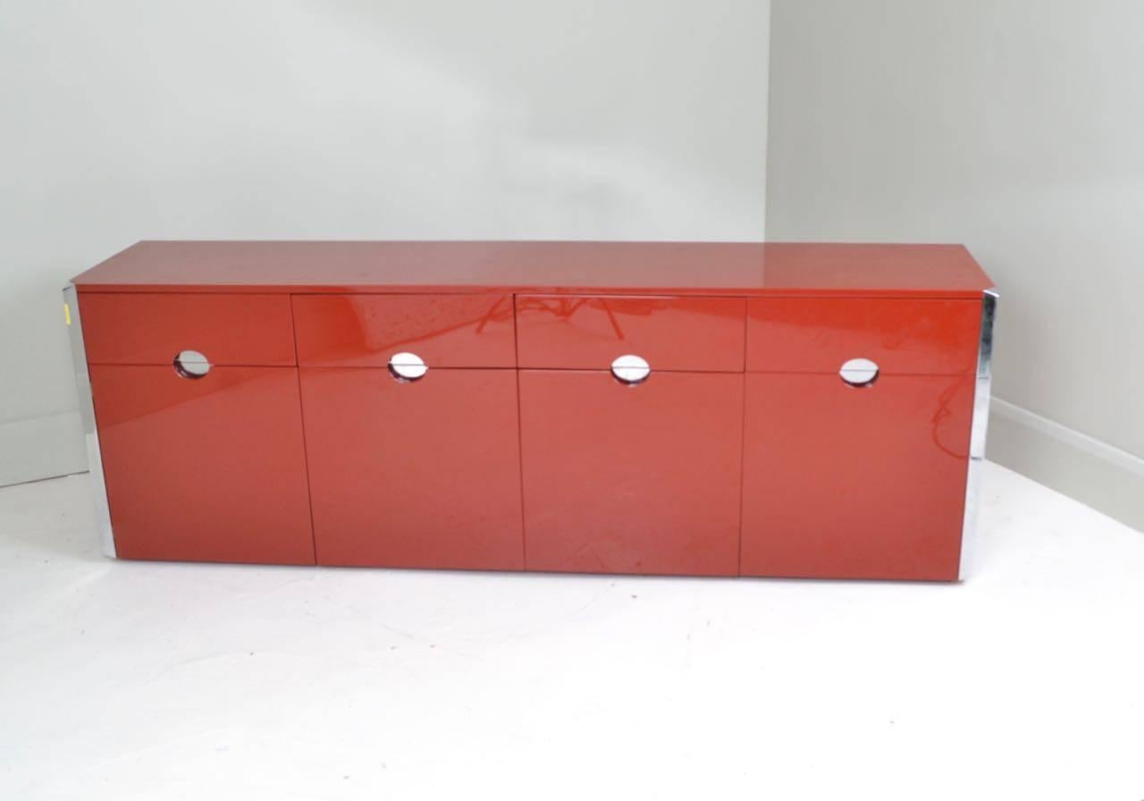 Rare four-drawer and four-door credenza in red lacquer and chromed steel
with adjustable shelves. Designed by Caccia Dominioni and produced by
Azucena, Italy, circa 1970. Brass makers label attached to the inside.