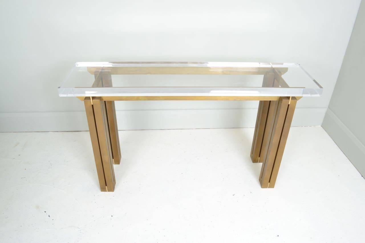 Good quality lacquered brass console table with 50mm thick,
perspex top.