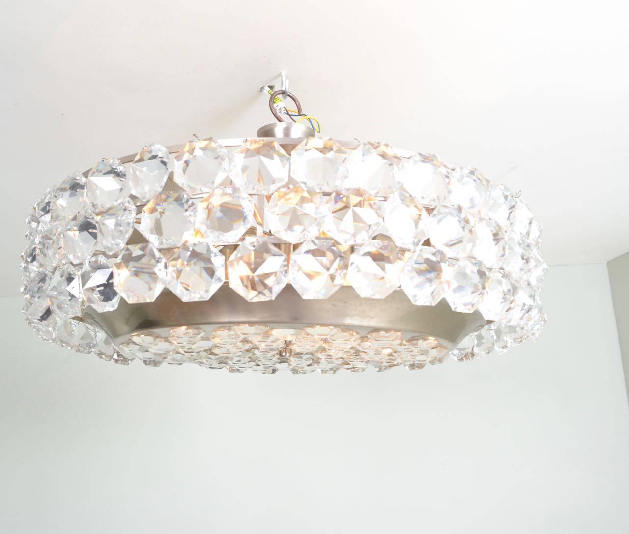 Drum style chandelier with facetted octagon crystals and nickel-plated
frame, in the manner of Bakalowits and Koehne, Austria, circa 1970.