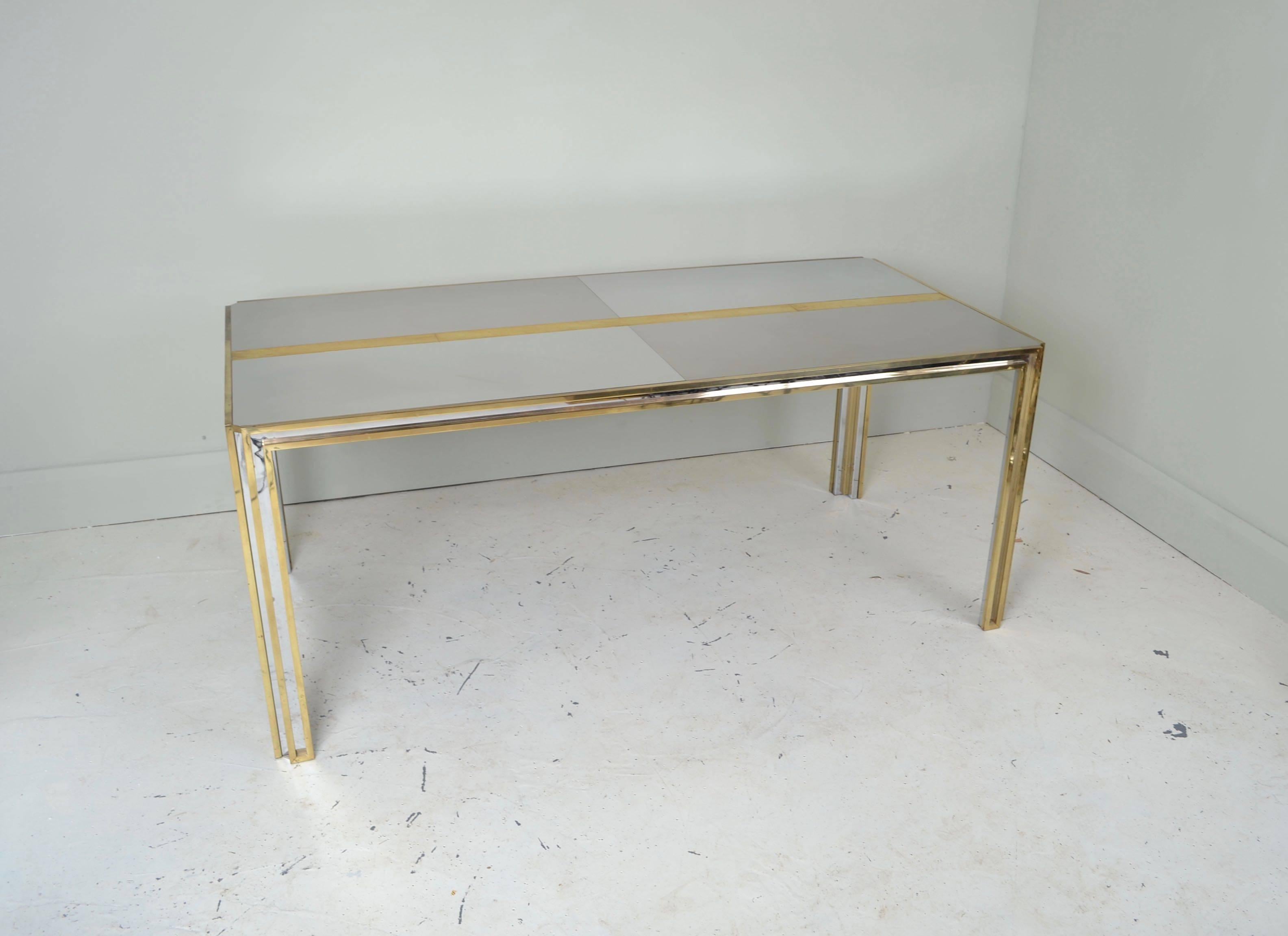 Patchwork stainless steel, brushed steel and brass table 
Manufactured in Italy, circa 1970
Good quality, heavy table with some light surface scratches from use.