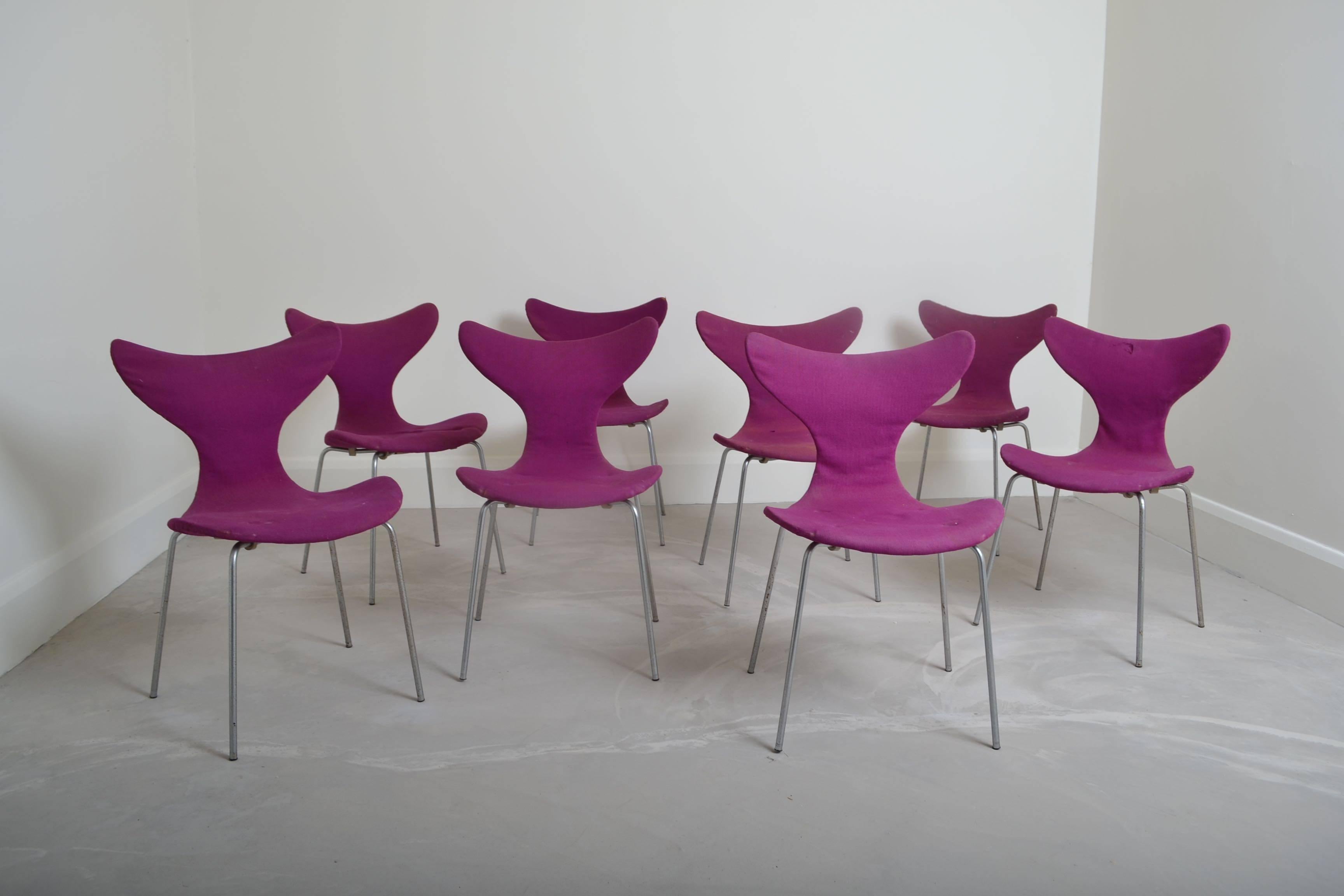 Set of eight 1950s lily chairs designed by Arne Jacobsen 
and manufactured by Fritz Hansen, Denmark.
Offered in original as found condition,
the foam and fabric has perished and will need to be replaced .
The images show pitting to the chrome