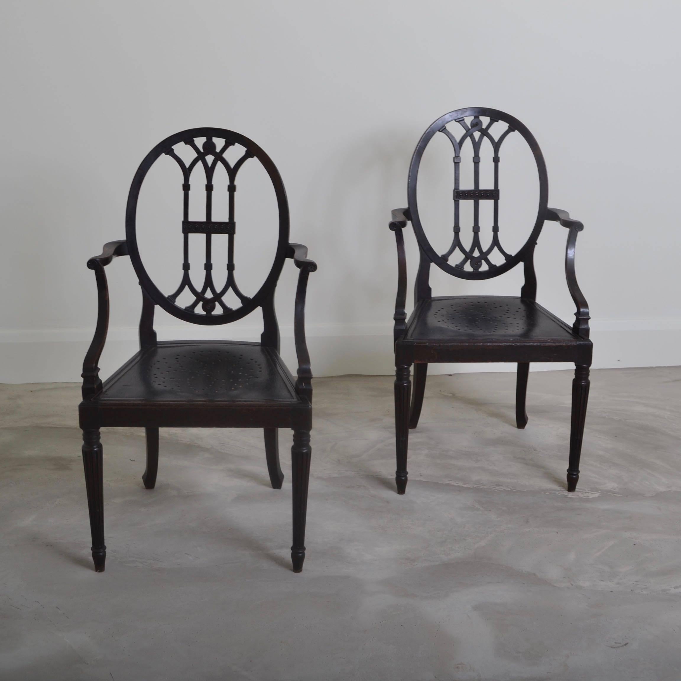 Pair of dark stained beech chairs originally from a Yacht.
The reversible seat pads were designed with a hole pattern to allow any sea water to
drain through .
An interesting and decorative pair of chairs.
