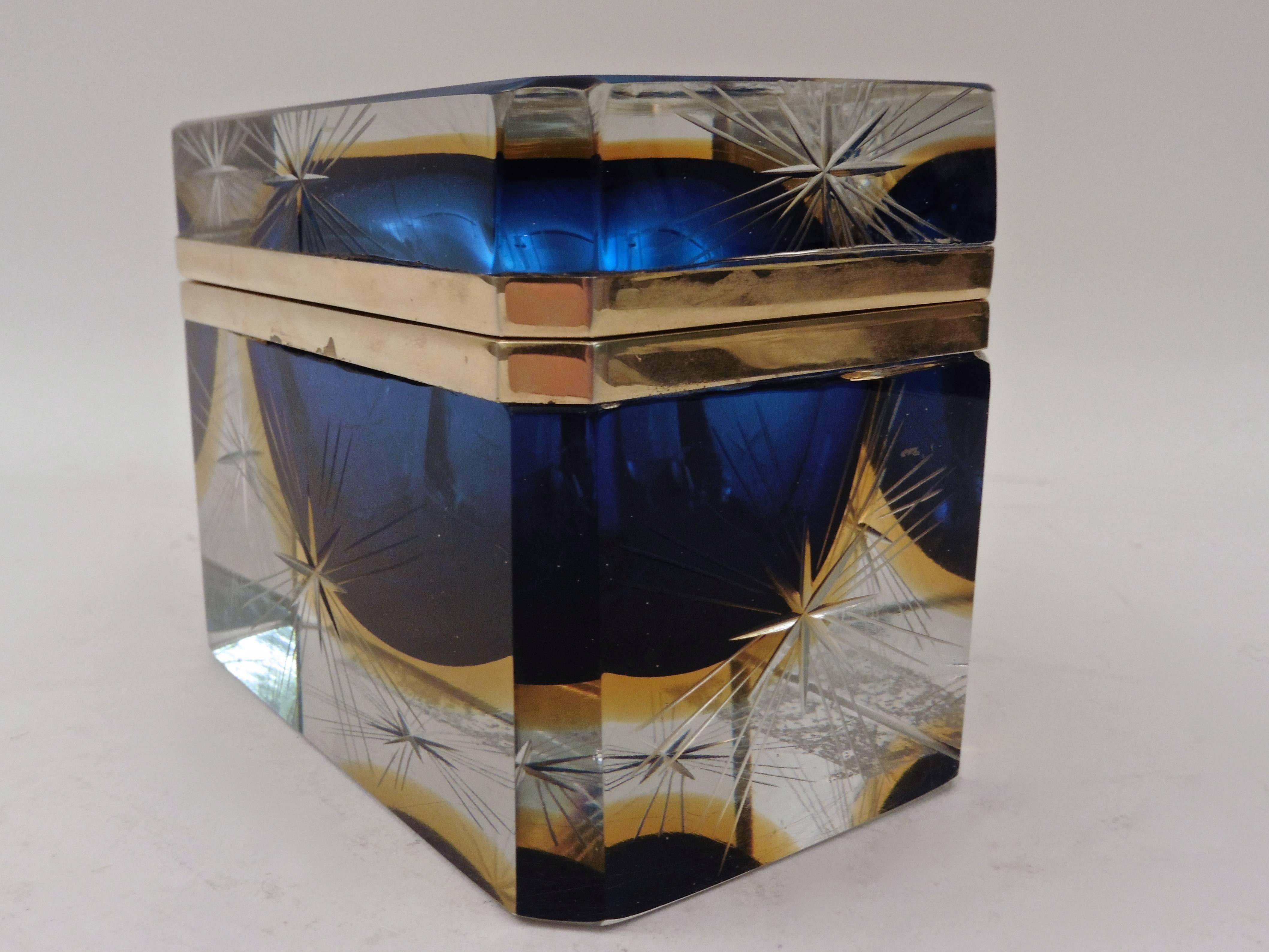 A rare and unusual Italian Murano Sommerso glass casket, circa 1960. The casing in clear engraved glass, the interior lined in blue and cased in pale amber.
