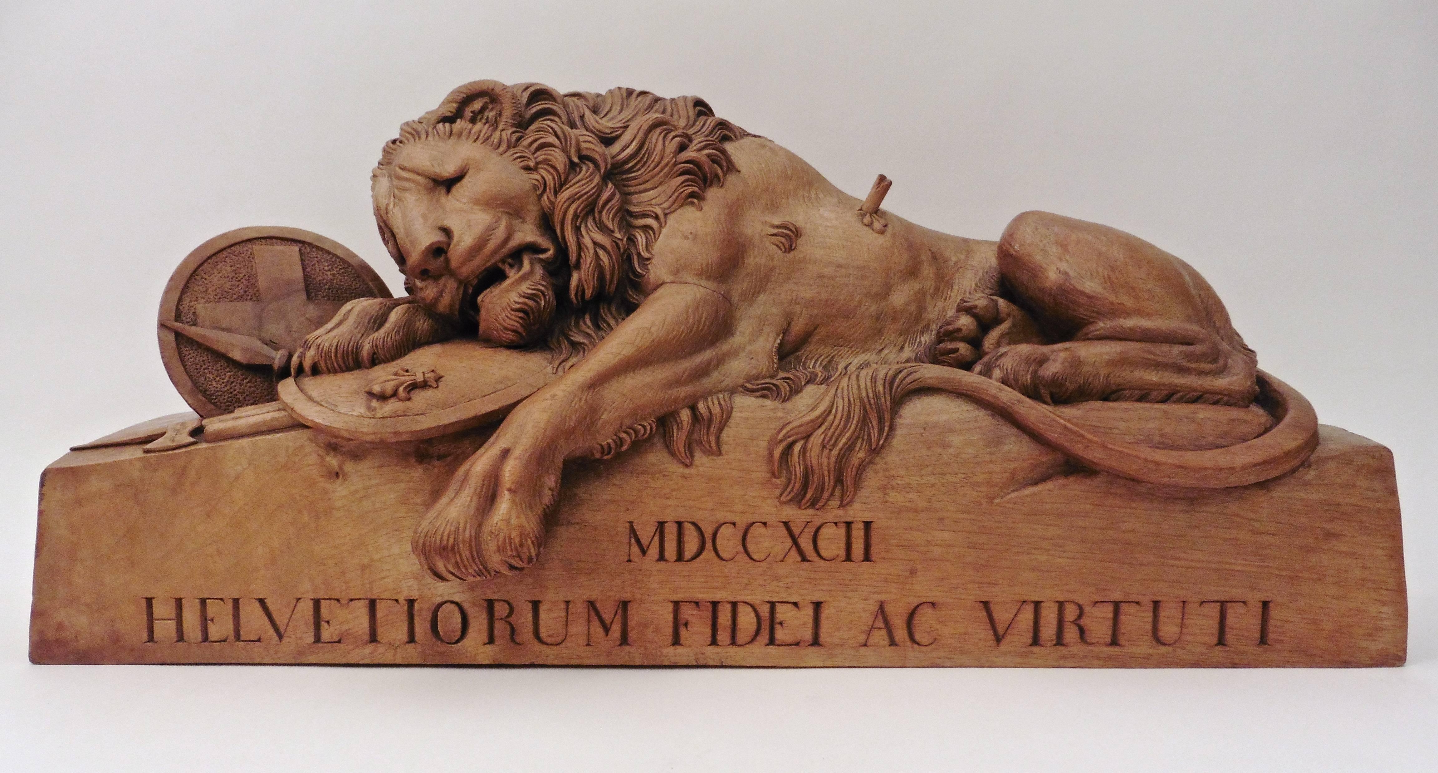 Large Swiss or Italian carved fruitwood model of “The Lion of Lucerne,” circa 1880. Along with Roman Numerals denoting the date (1792), also inscribed is 'Helvetiorum Fidei Ac Virtuti' which translates as 'To the Loyalty and Bravery of the Swiss.'