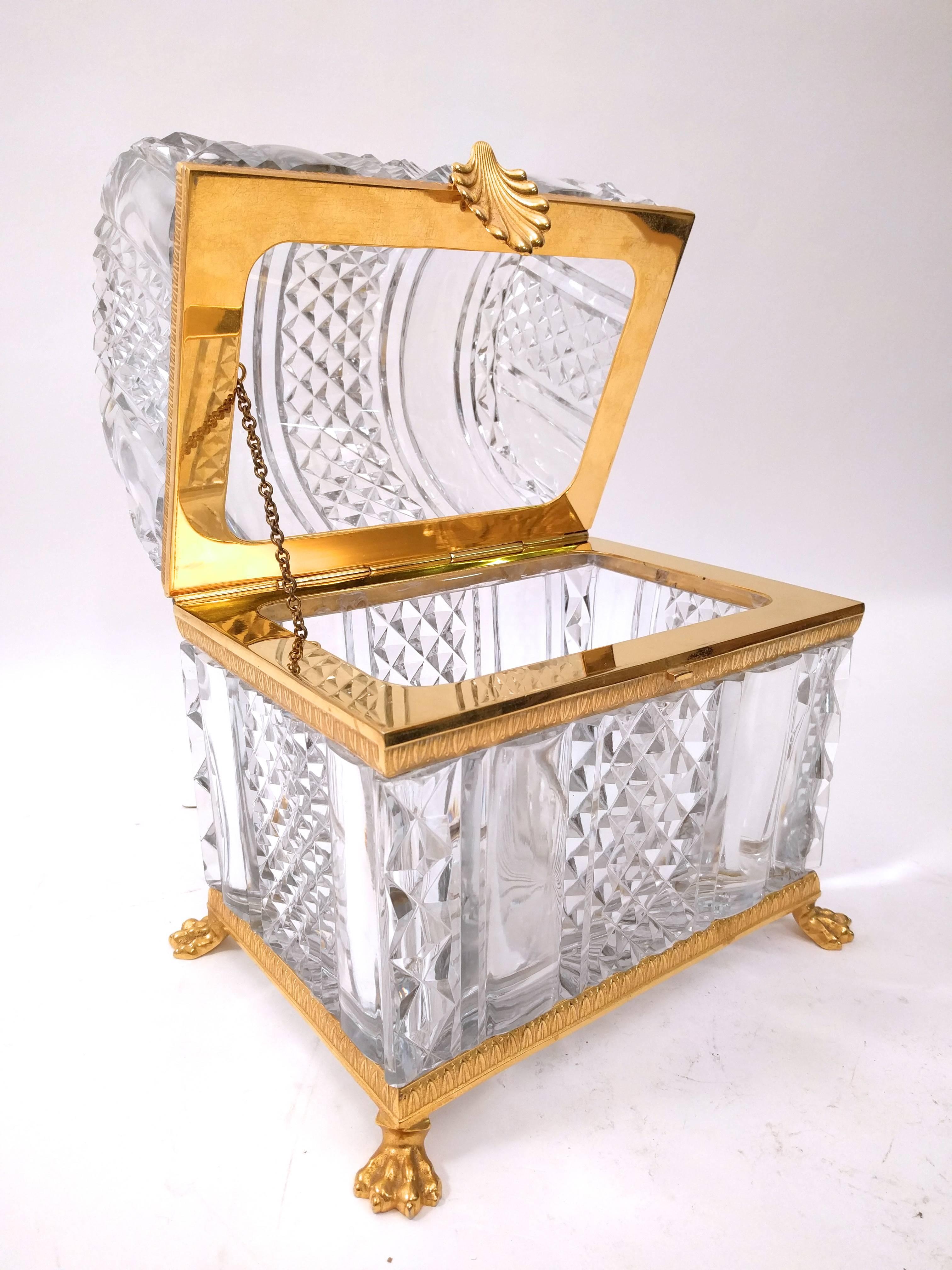 Unusually large crystal and gilt bronze domed top casket. With a pillar and diamond cut design, standing on paw feet and with a shell clasp, French, early 20th century.


                       