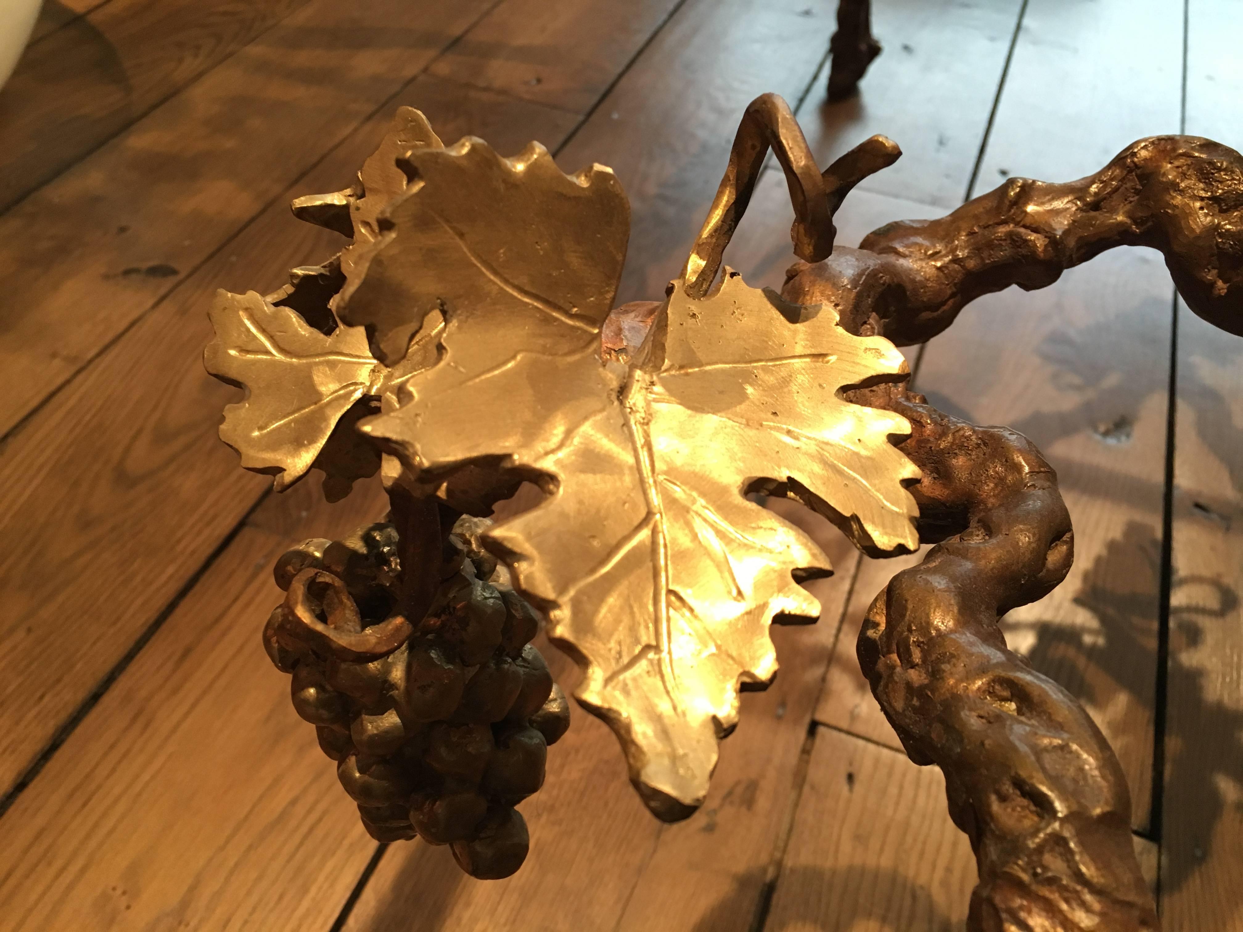 A fantastic one-of-a-kind centre table by the Belgian artist Paula Swinnen.
Ideal as a centre table for a wine tasting room, or indeed a statement piece for any room, this rectangular table is in cast bronze, the legs as gnarled vines supporting a