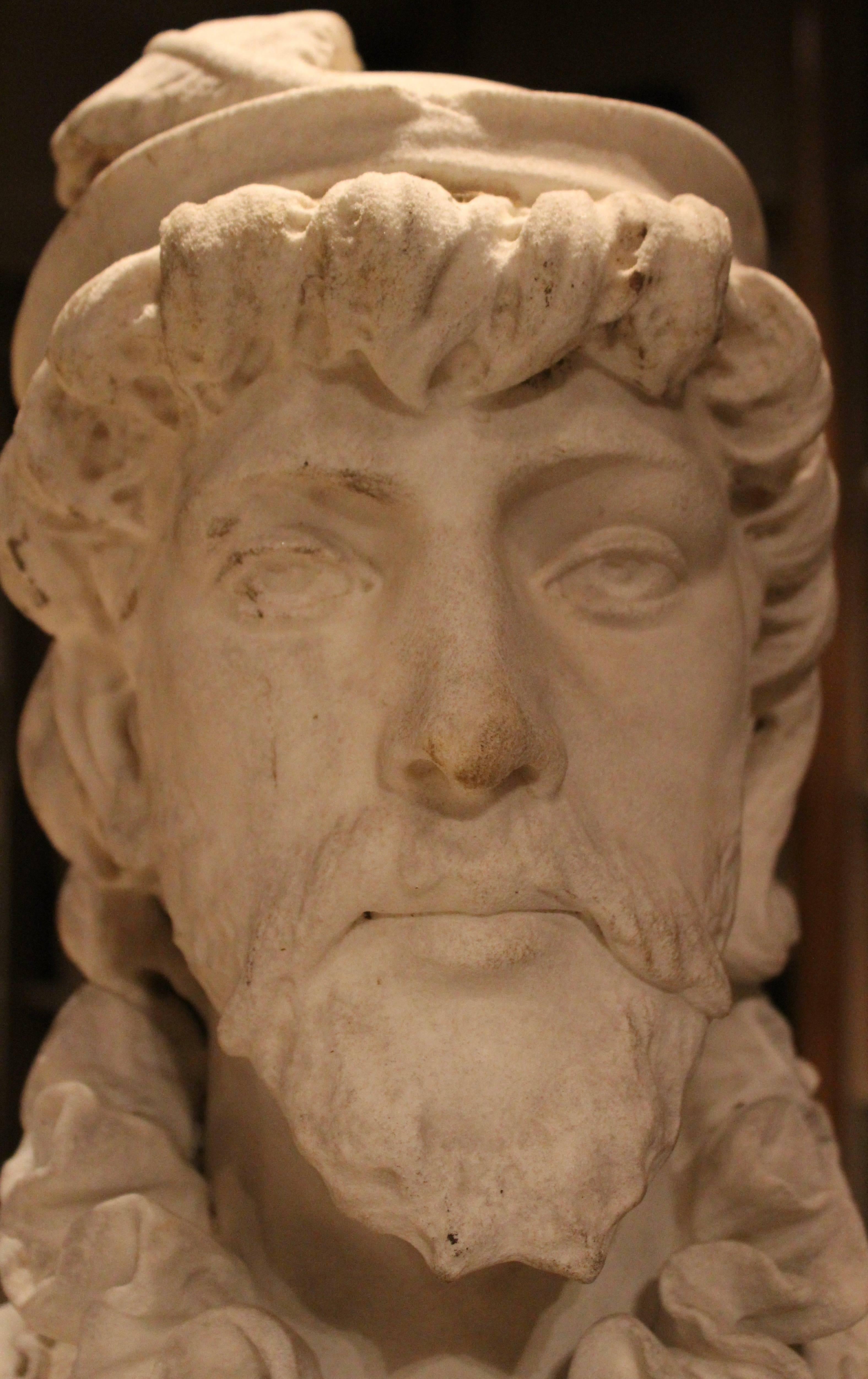 Marble bust of a Renaissance prince, Italy, circa 1850. Sporting a feather cap on his head, intricately carved curls and a full beard, with a pointed, Patrician's nose. With a loose ruff around his neck and a carved medallion on a chain. Subtle