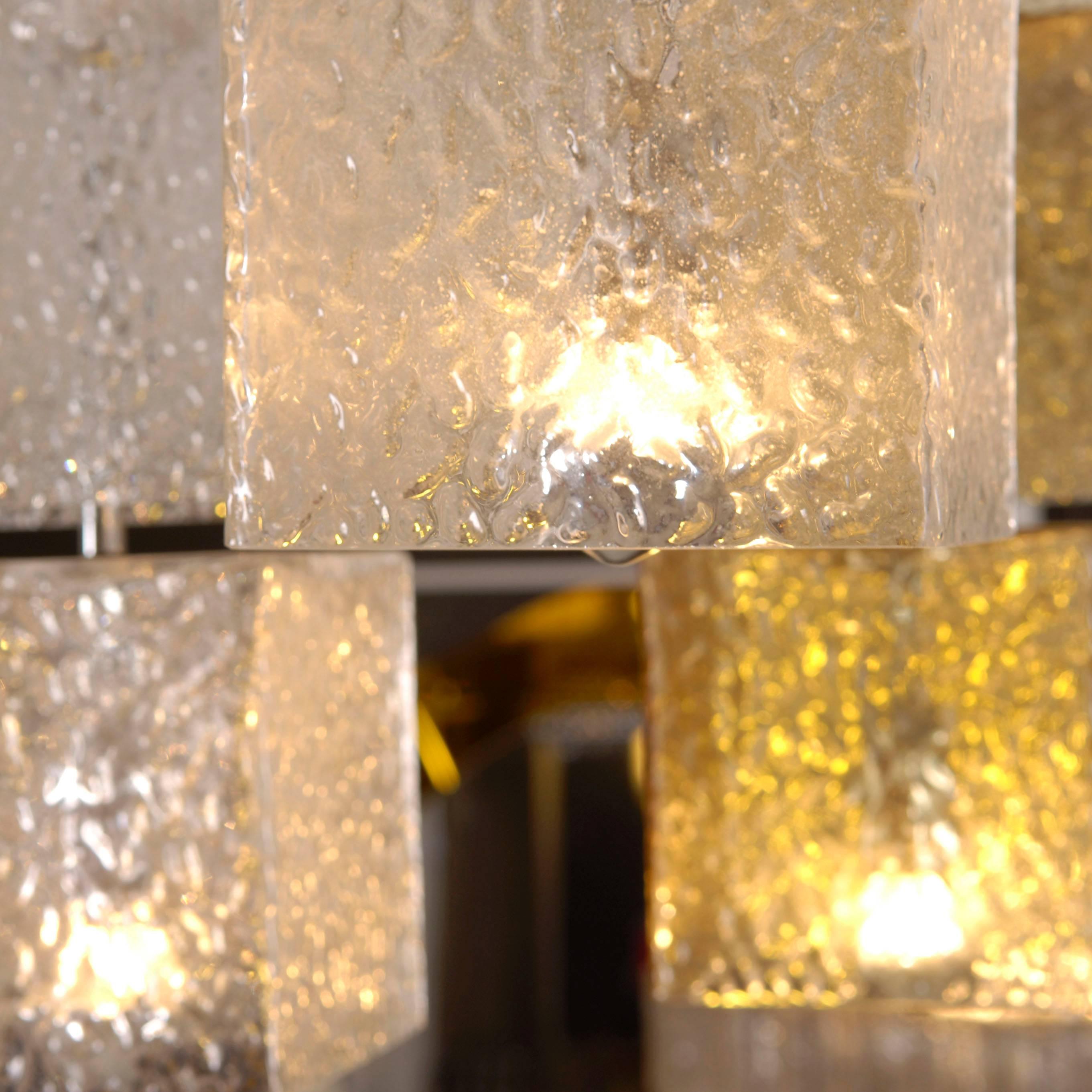Glass cube ceiling light with brass ceiling plate, Italy, 1960s. 

Each light is made up of several individual glass cubes in different sizes and colours. Please note that dimensions may differ depending on how the glass cubes are installed.